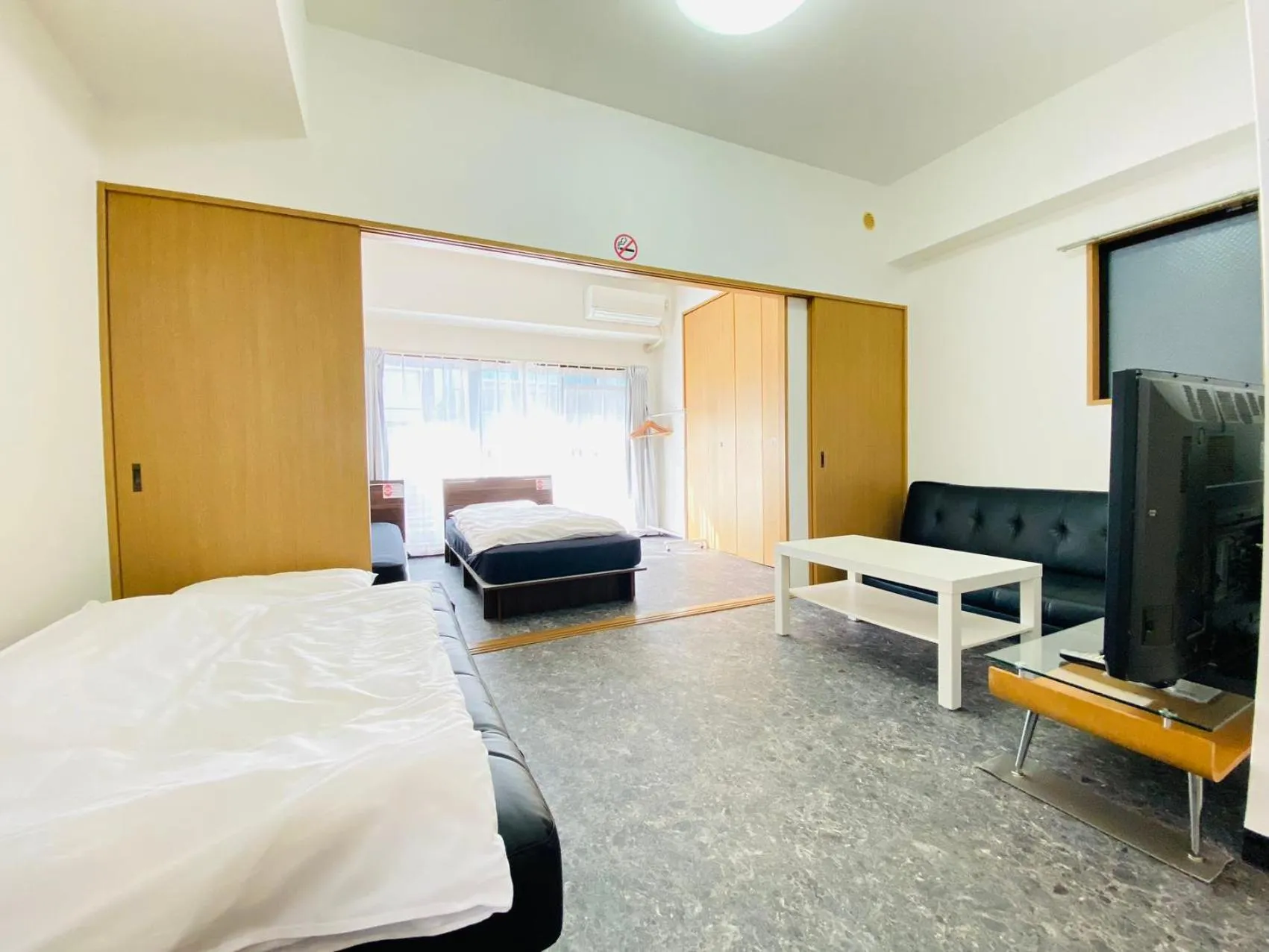 Bed in Grande Famille Shimanouchi Dotonbori Condo