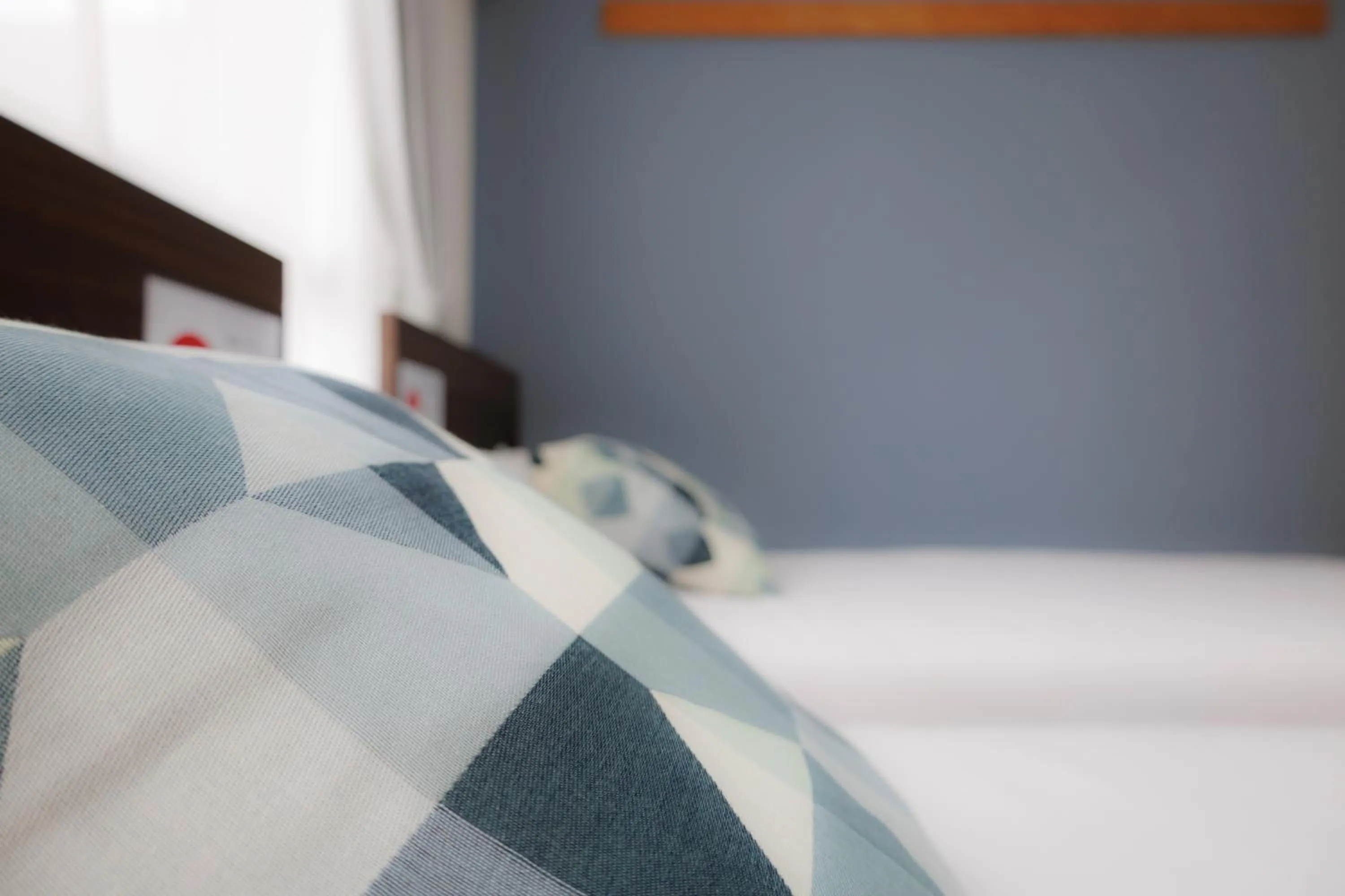 Bed in Grande Famille Shimanouchi Dotonbori Condo