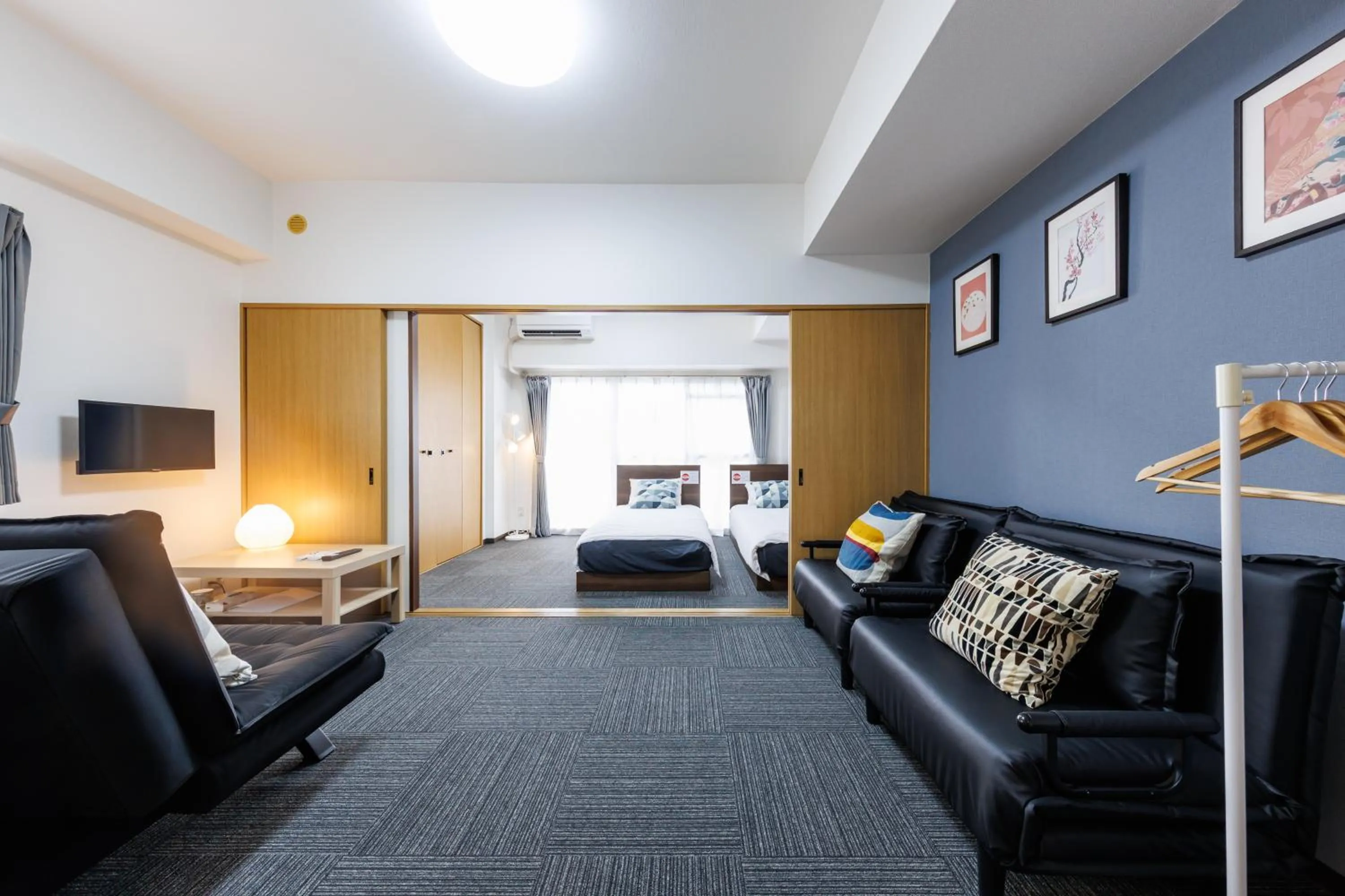 Bed in Grande Famille Shimanouchi Dotonbori Condo