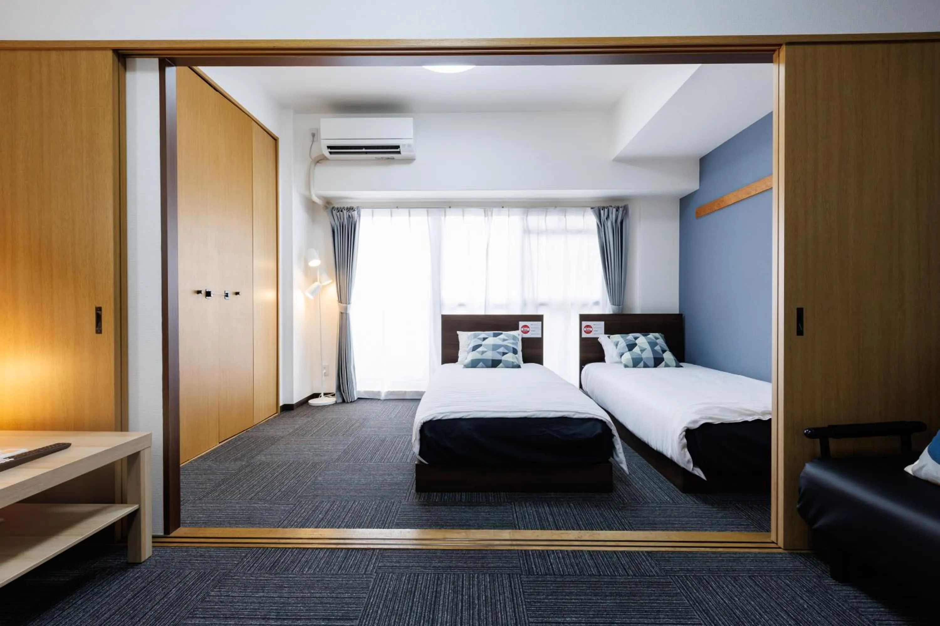 Bed in Grande Famille Shimanouchi Dotonbori Condo