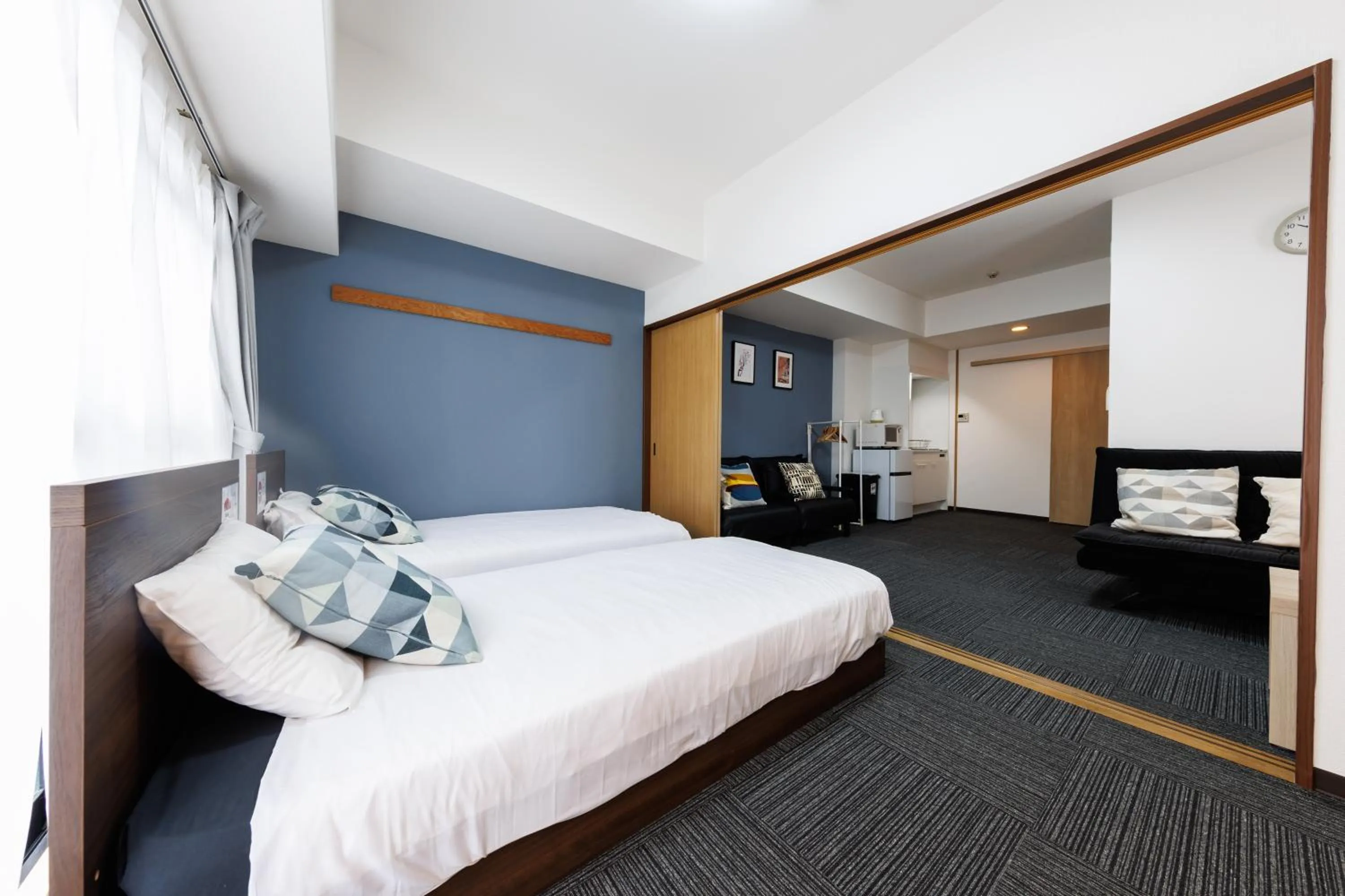 Bed in Grande Famille Shimanouchi Dotonbori Condo