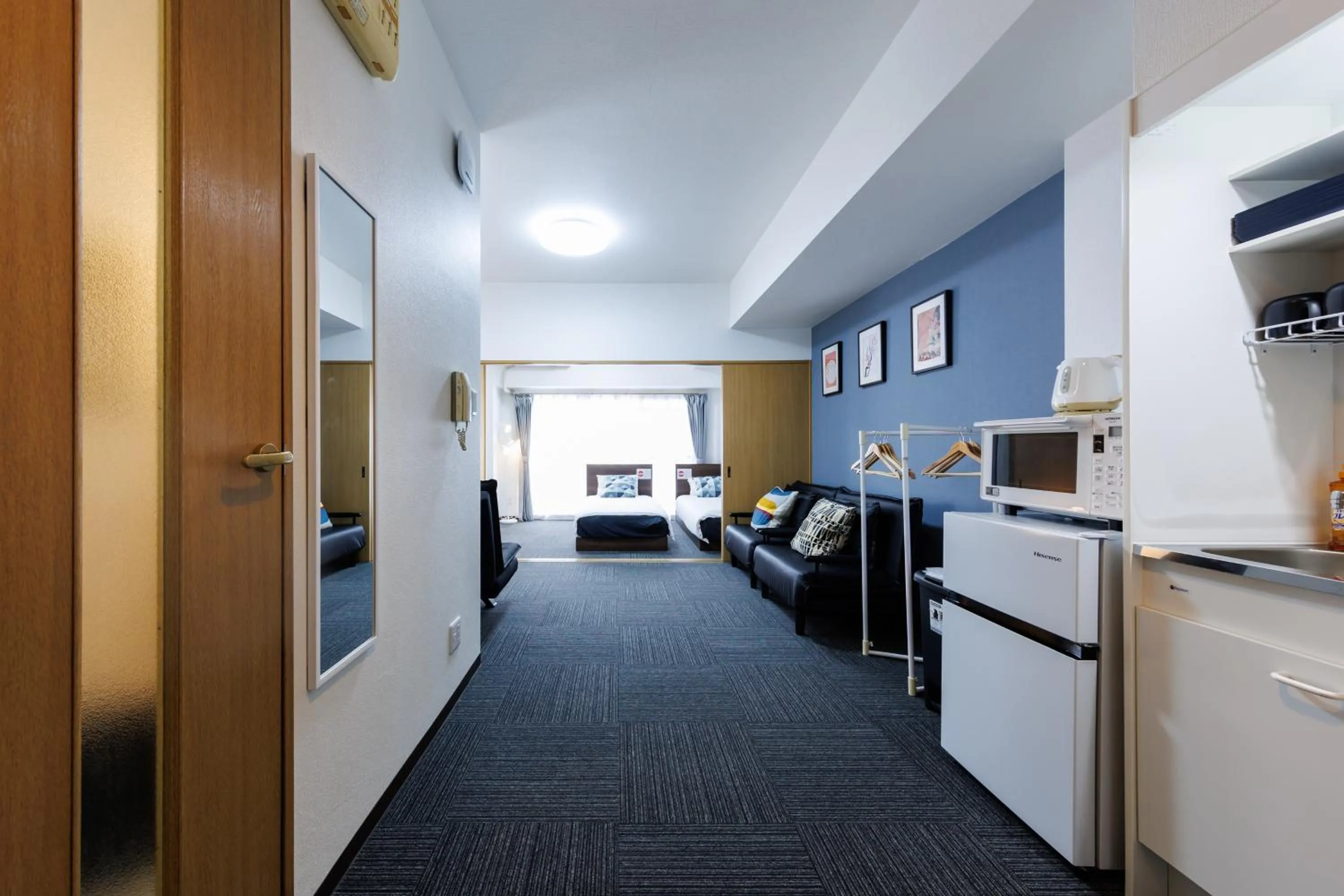 Bed in Grande Famille Shimanouchi Dotonbori Condo