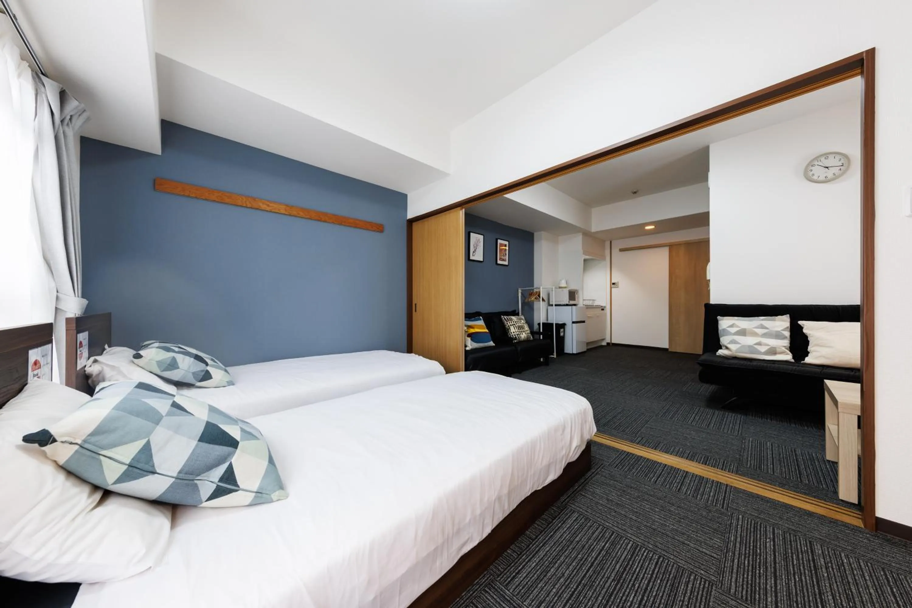 Bed in Grande Famille Shimanouchi Dotonbori Condo