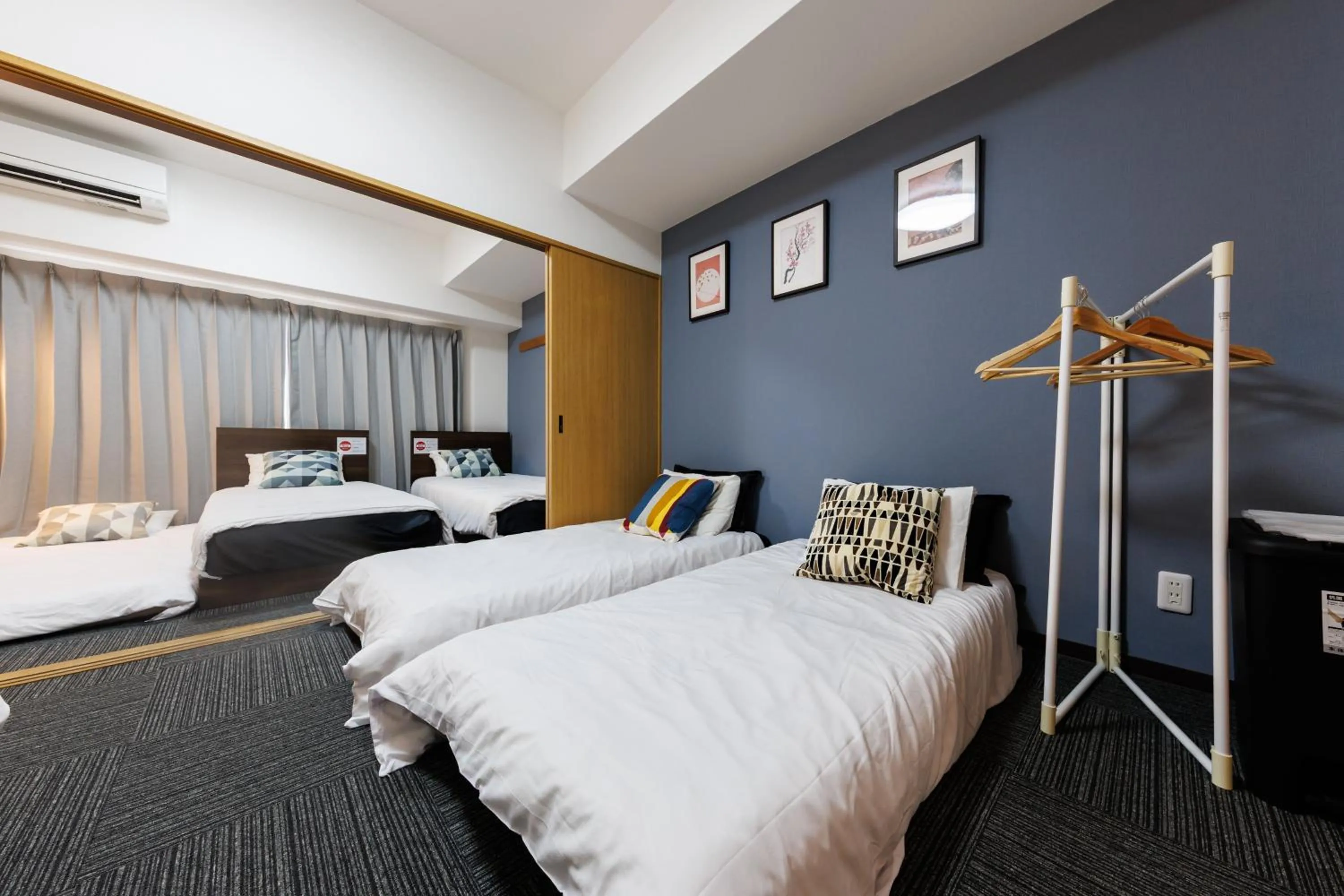 Bed in Grande Famille Shimanouchi Dotonbori Condo