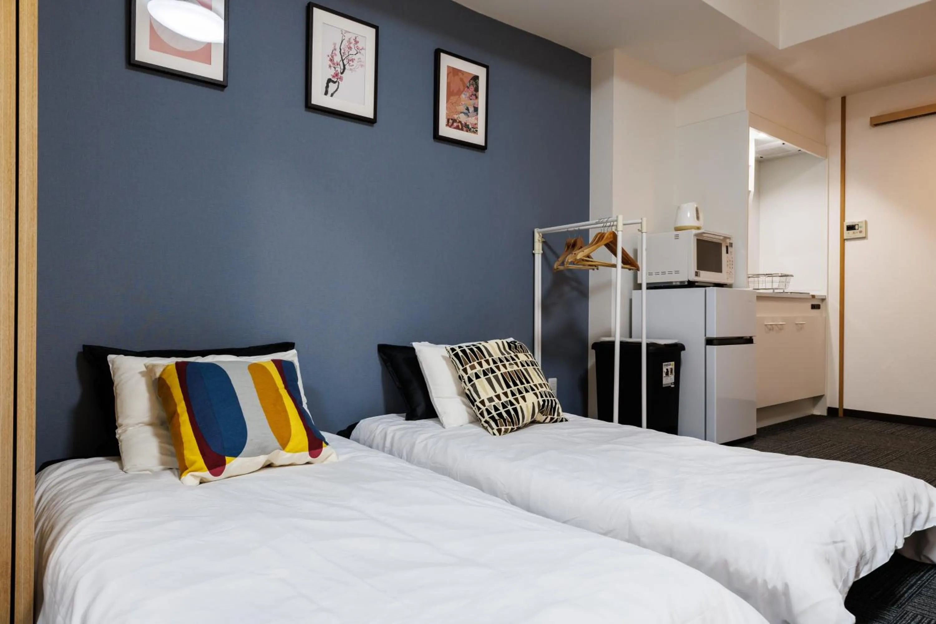 Bed in Grande Famille Shimanouchi Dotonbori Condo