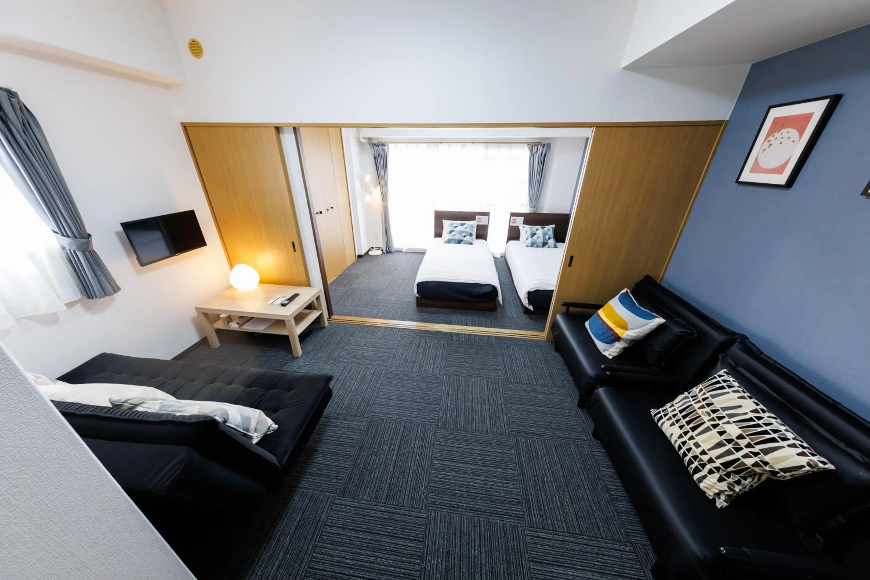 Bed in Grande Famille Shimanouchi Dotonbori Condo