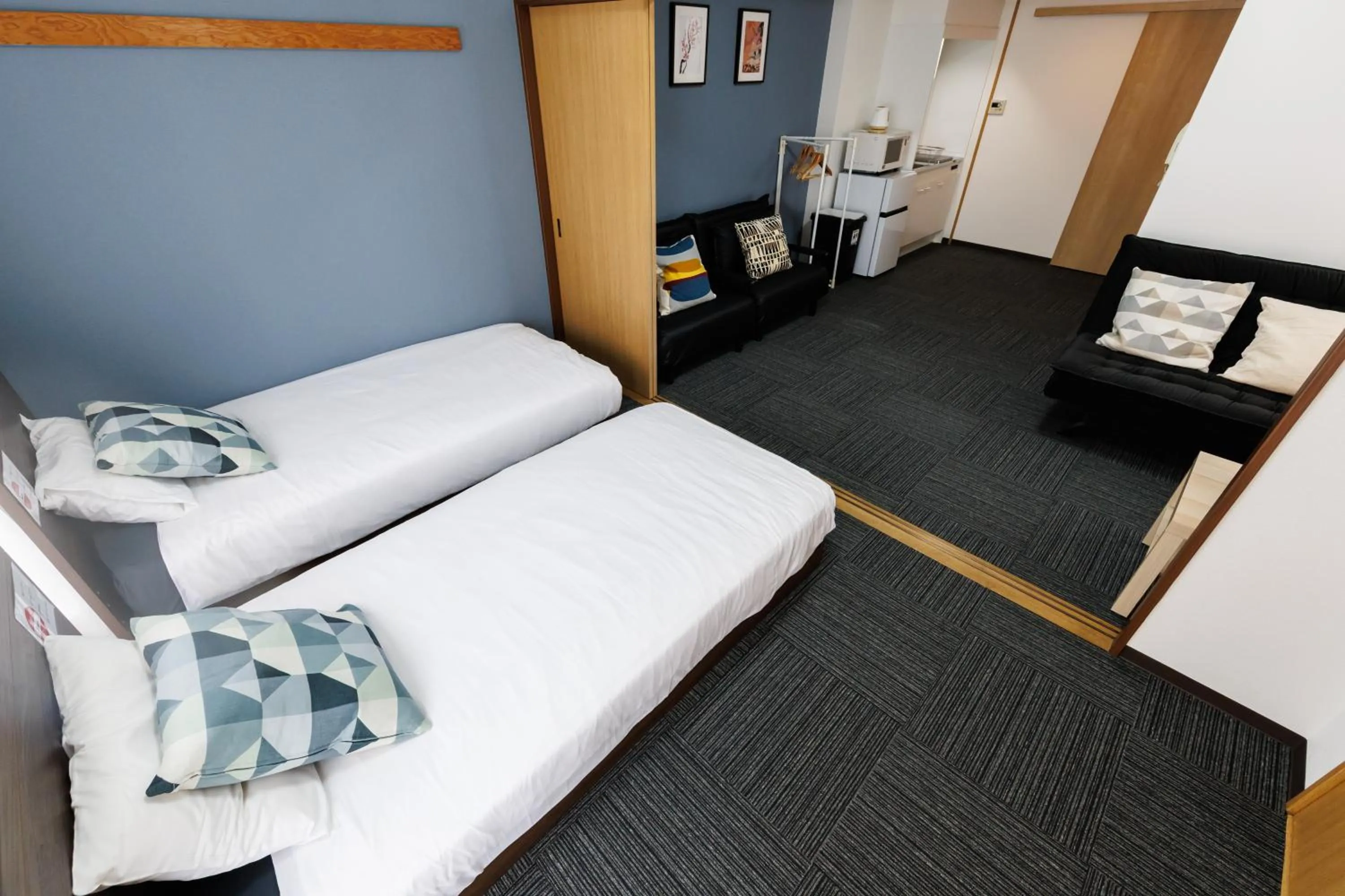 Bed in Grande Famille Shimanouchi Dotonbori Condo