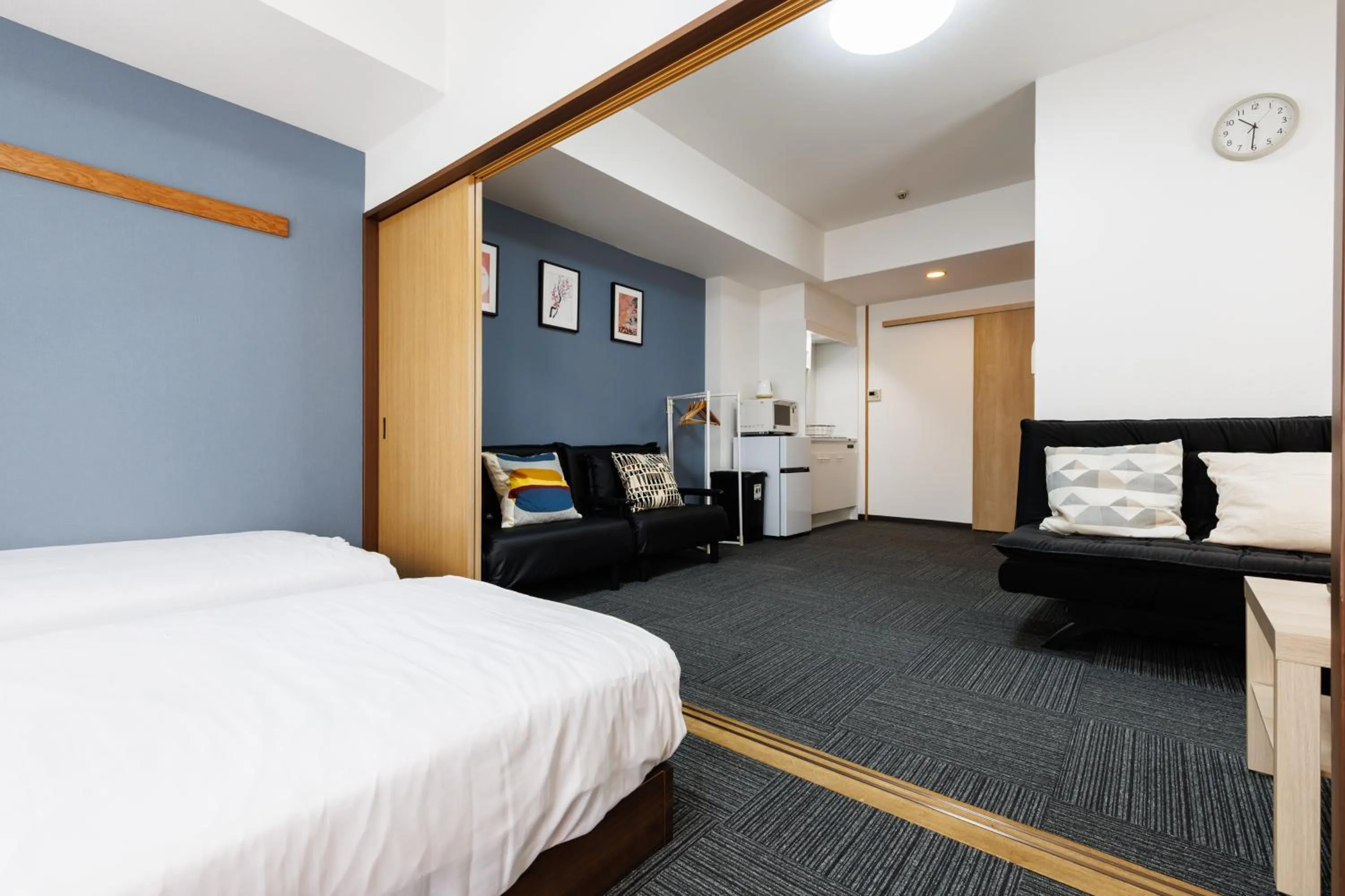 Bed in Grande Famille Shimanouchi Dotonbori Condo