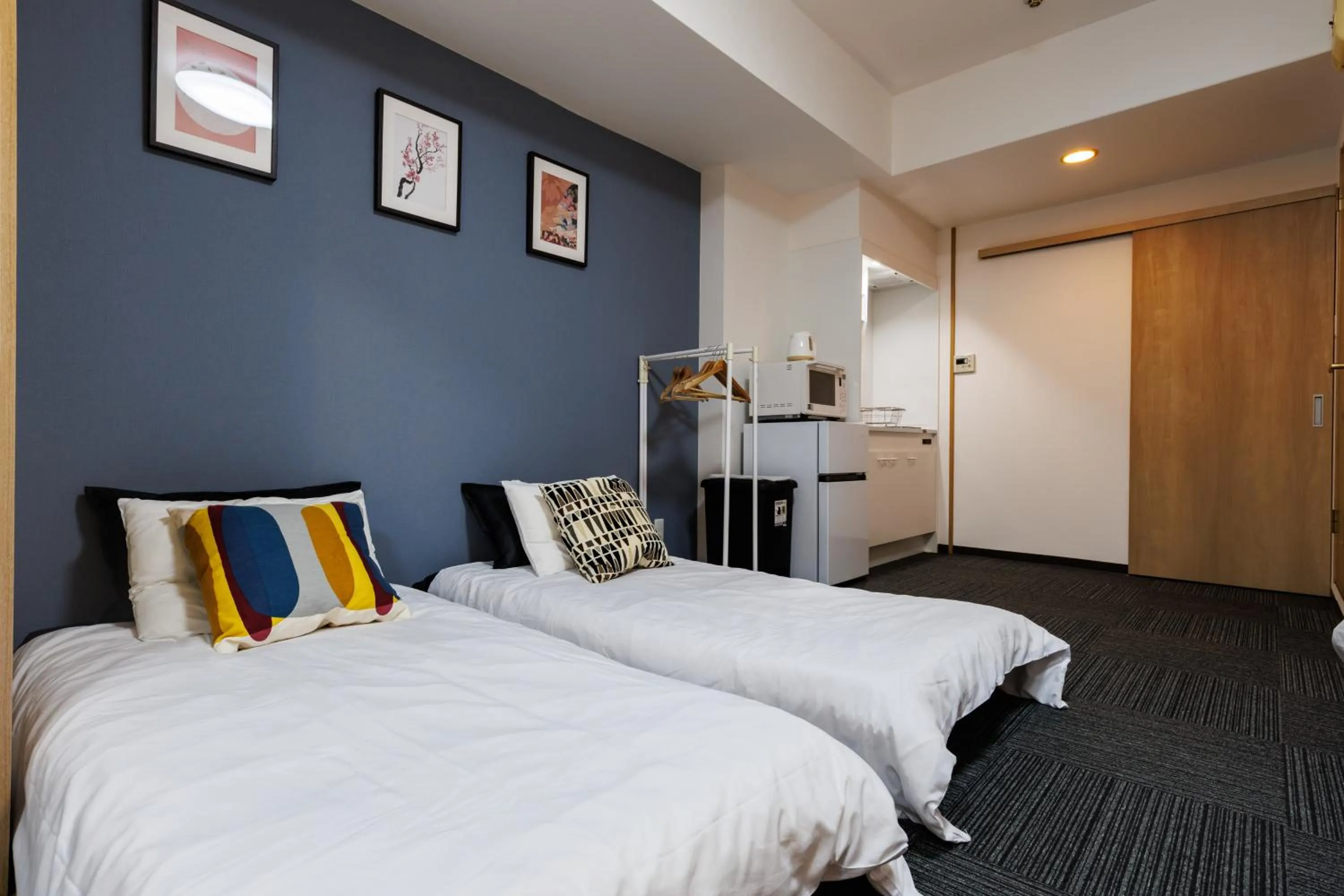 Bed in Grande Famille Shimanouchi Dotonbori Condo