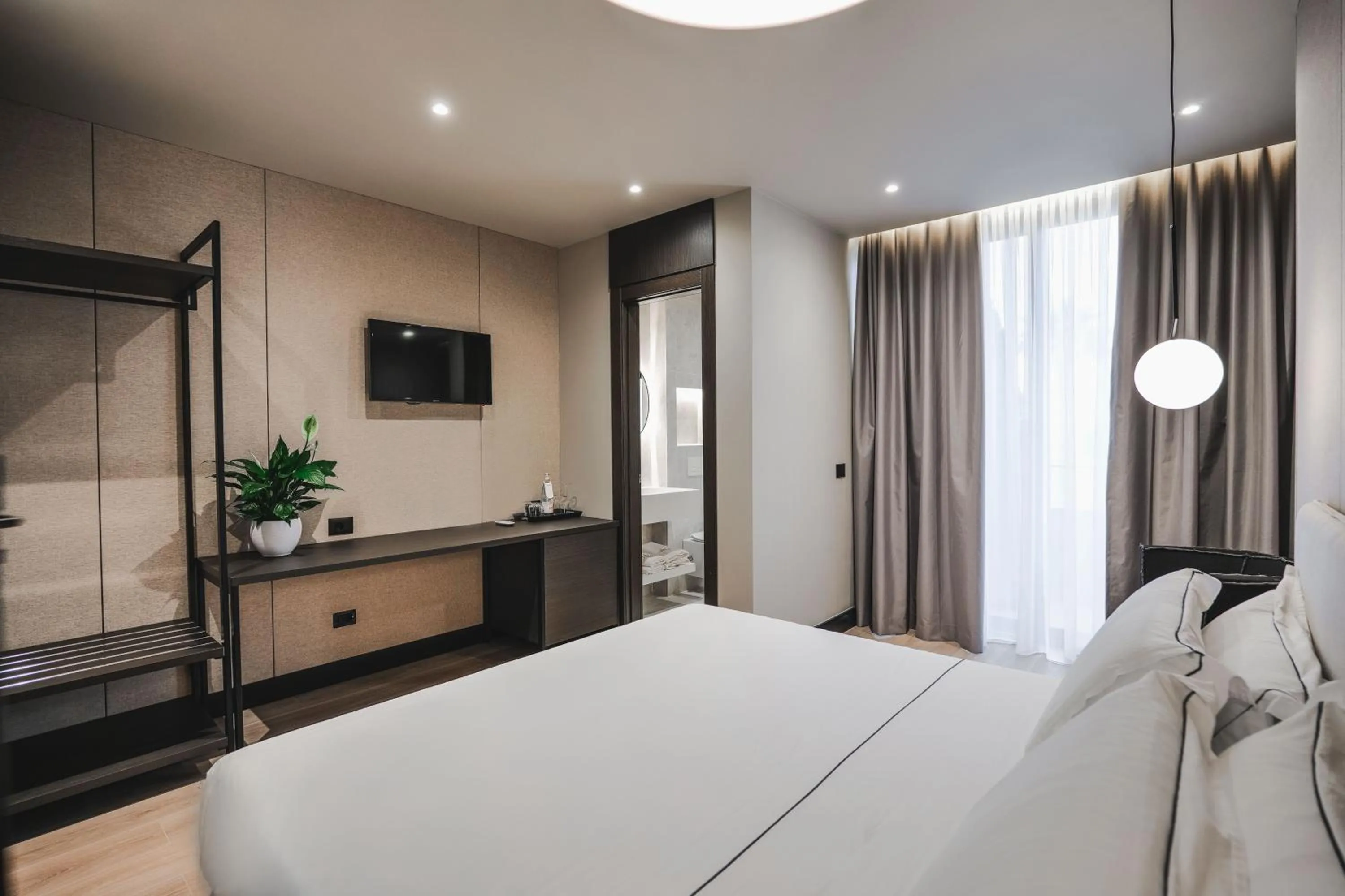 Bed in Miramare Boutique Hotel