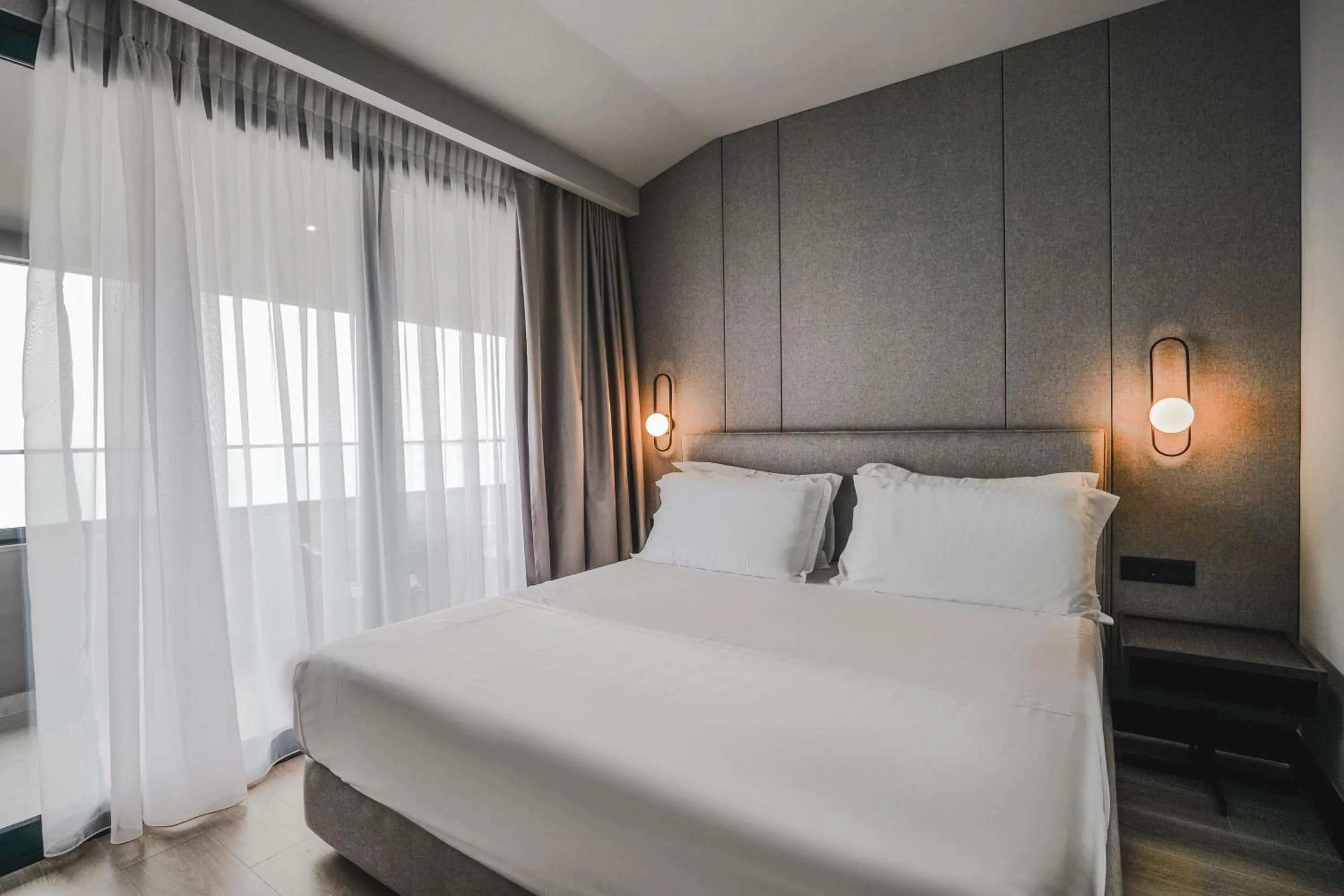 Bed in Miramare Boutique Hotel