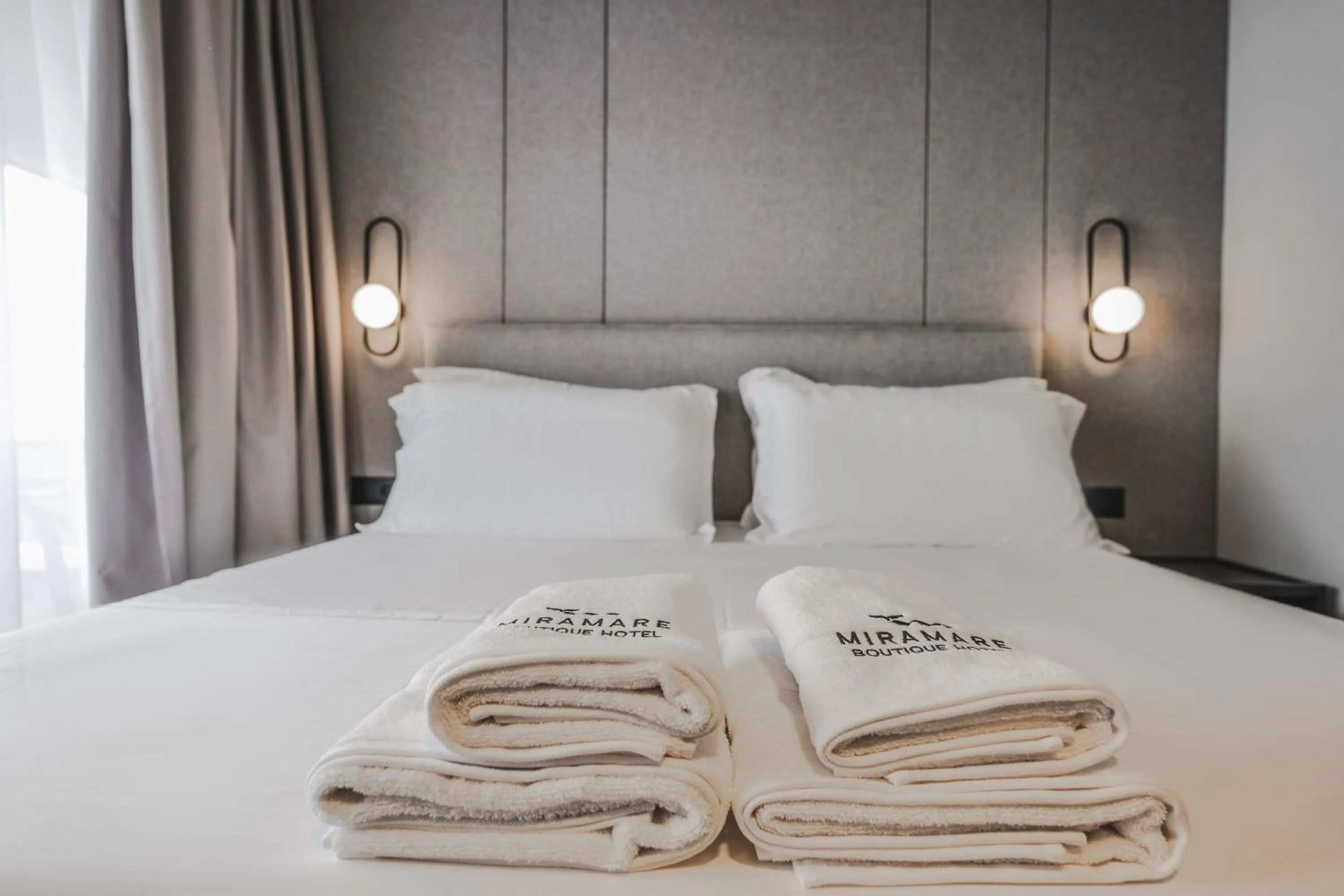 Bed in Miramare Boutique Hotel