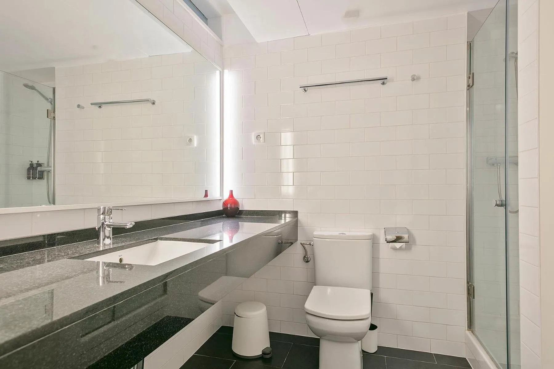 Bathroom in Lugaris Beach Apartments