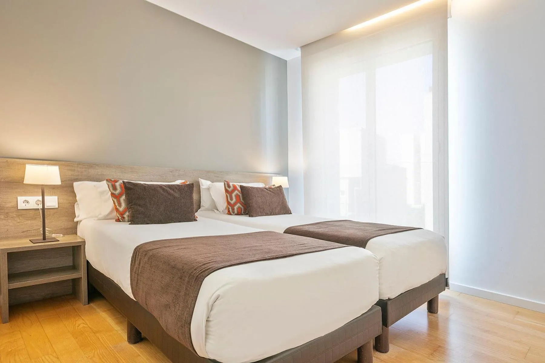 Bed in Lugaris Beach Apartments