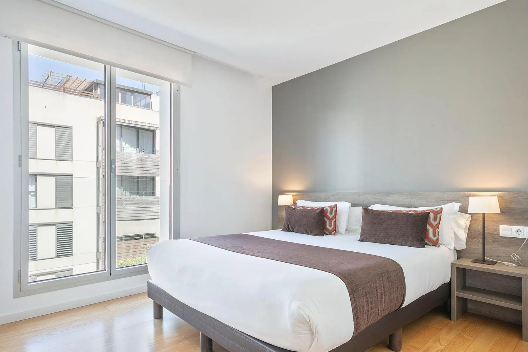 Bed in Lugaris Beach Apartments