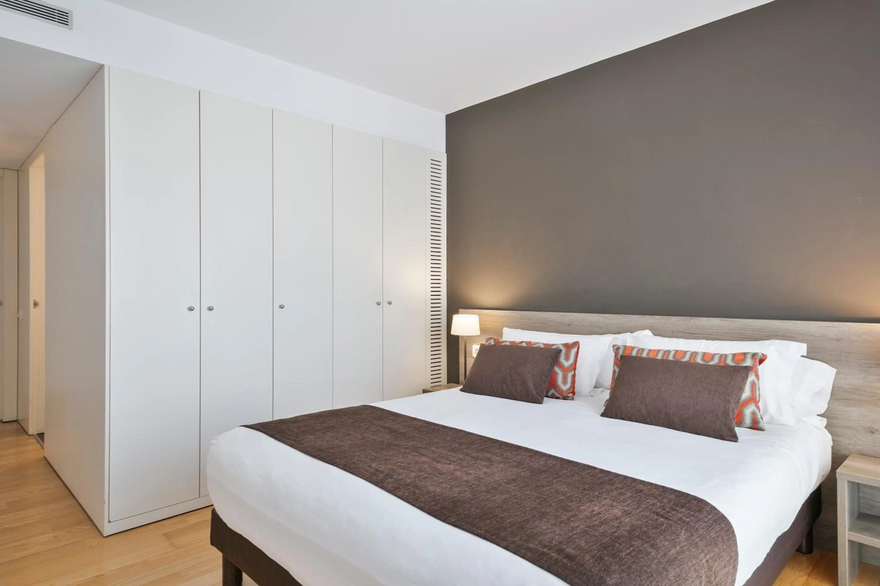 Bed in Lugaris Beach Apartments