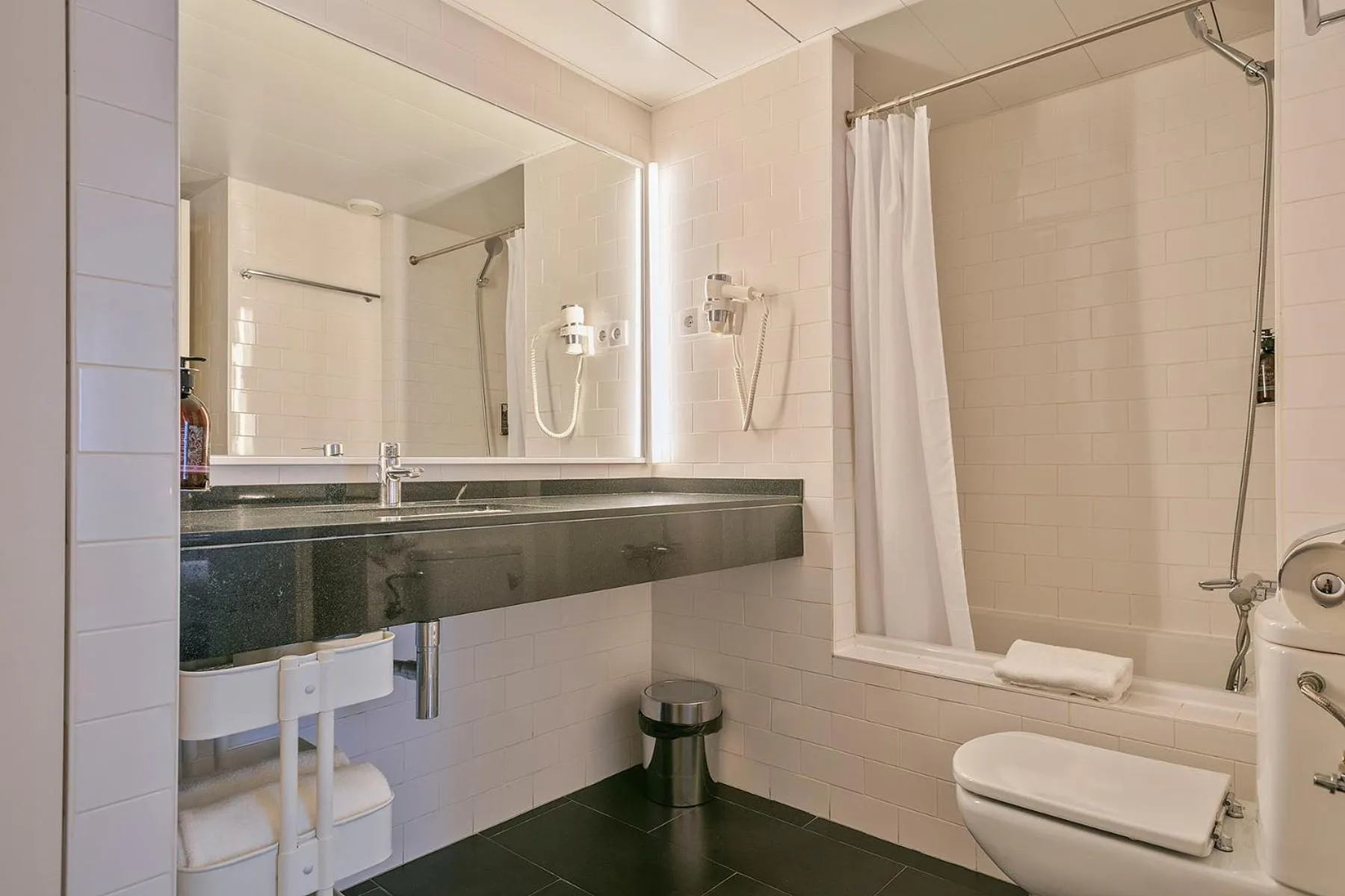 Bathroom in Lugaris Beach Apartments
