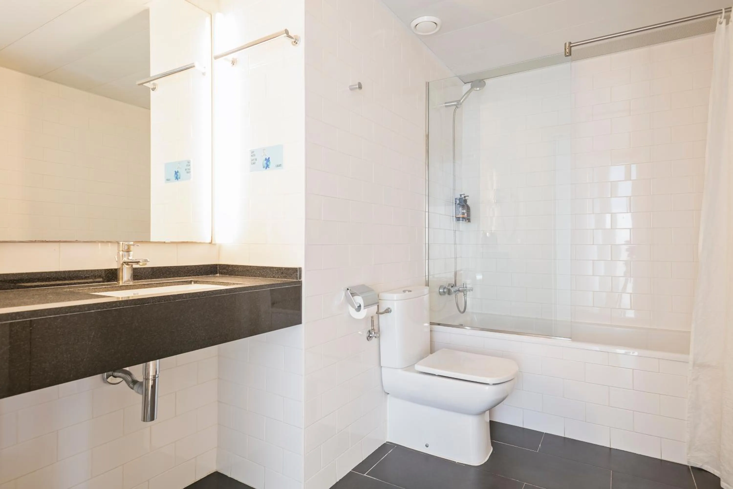 Bathroom in Lugaris Beach Apartments