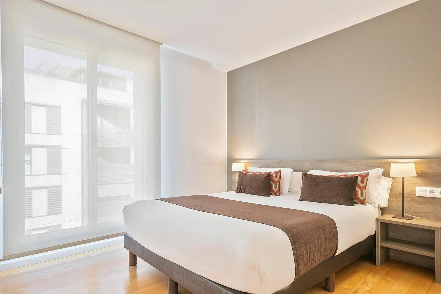 Bed in Lugaris Beach Apartments