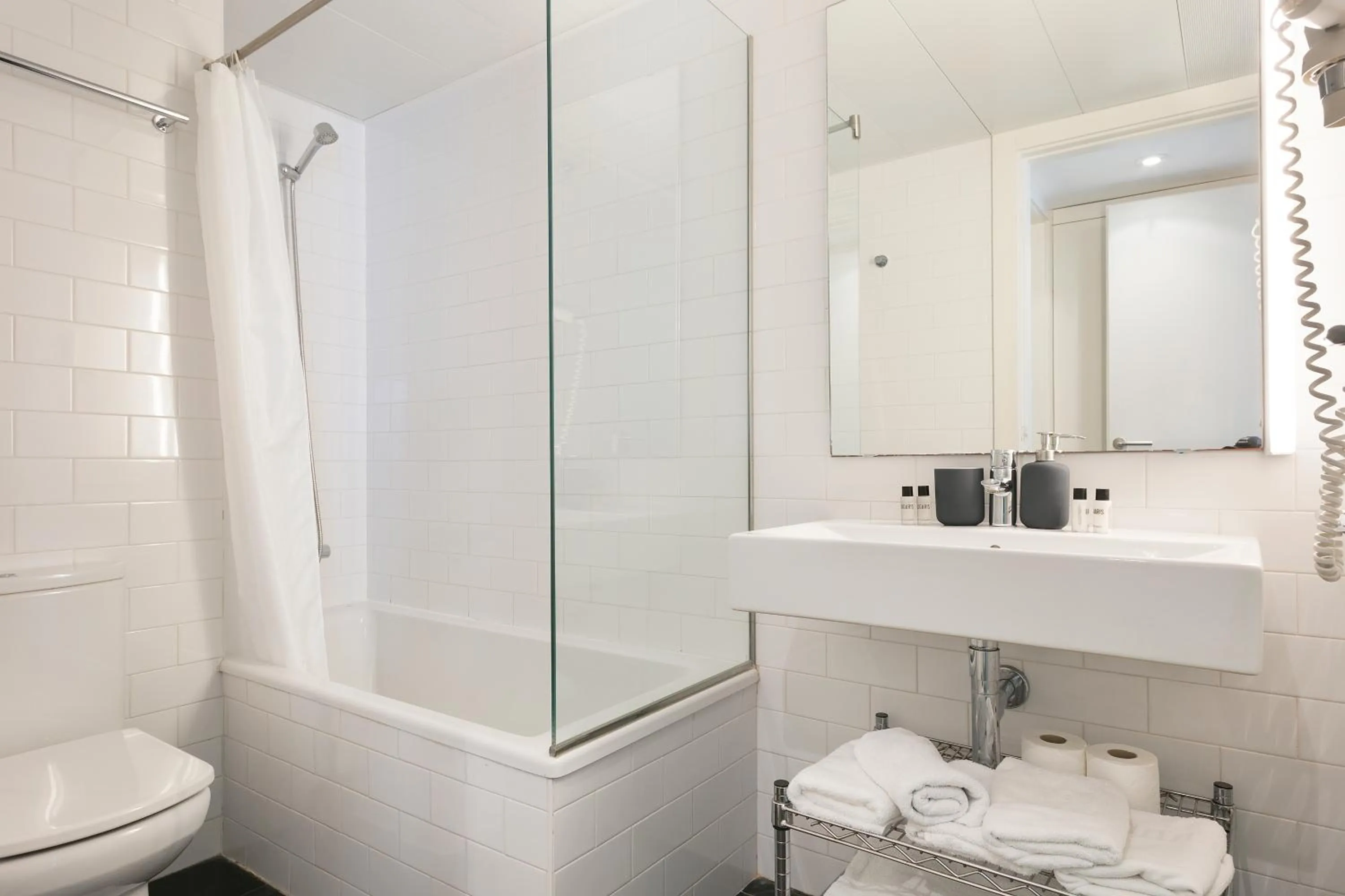 Bathroom in Lugaris Beach Apartments