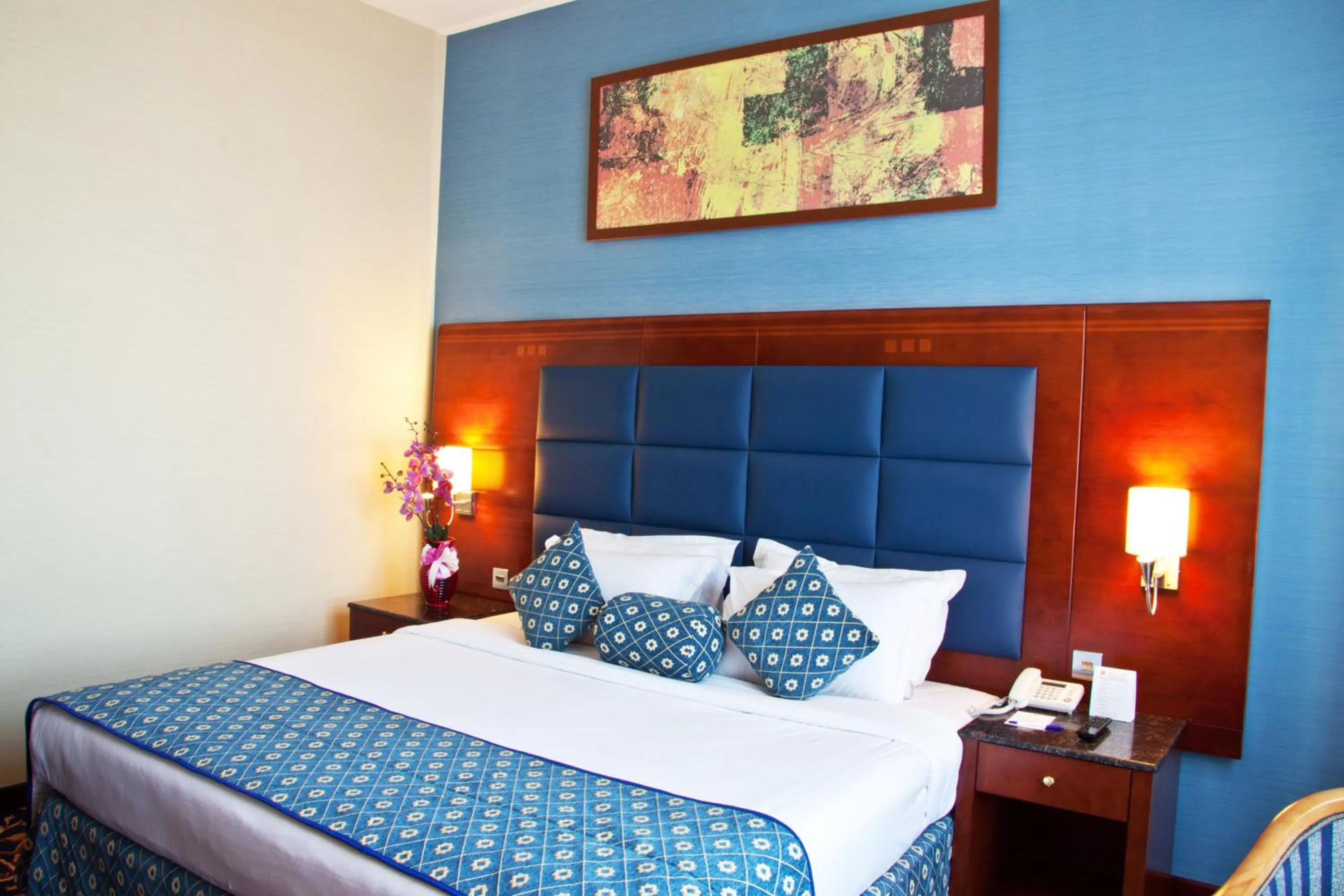 Bed in Ramee Rose Hotel