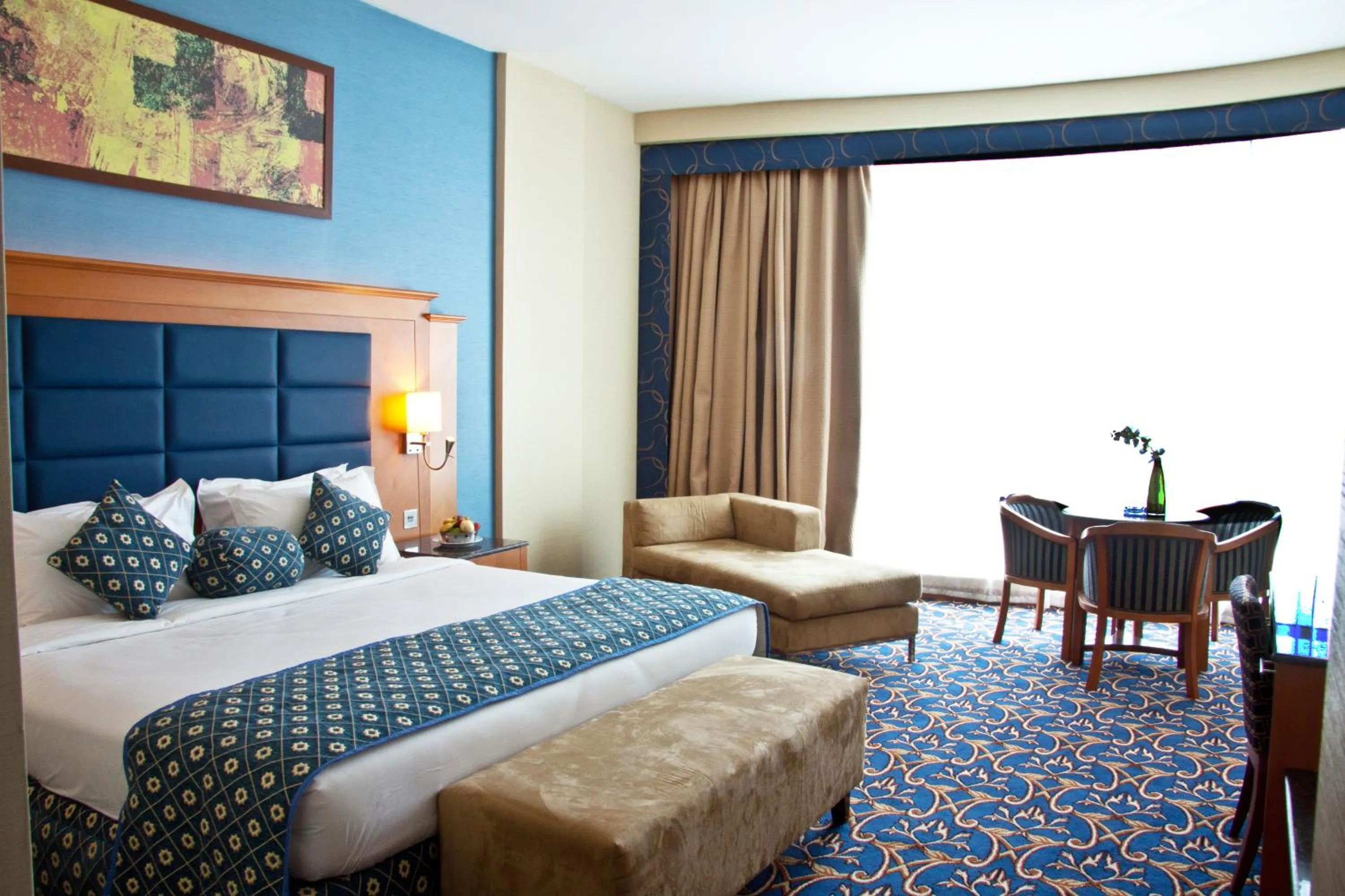 Bed in Ramee Rose Hotel