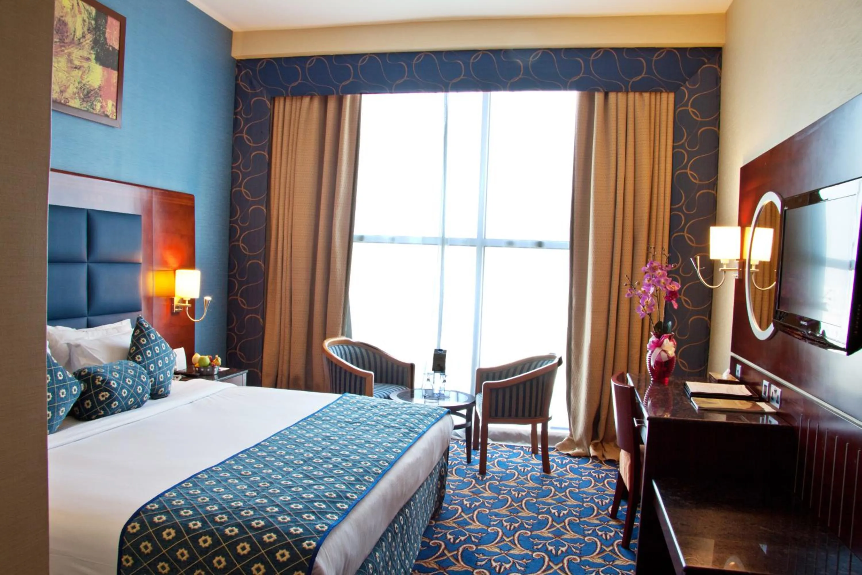 Bed in Ramee Rose Hotel