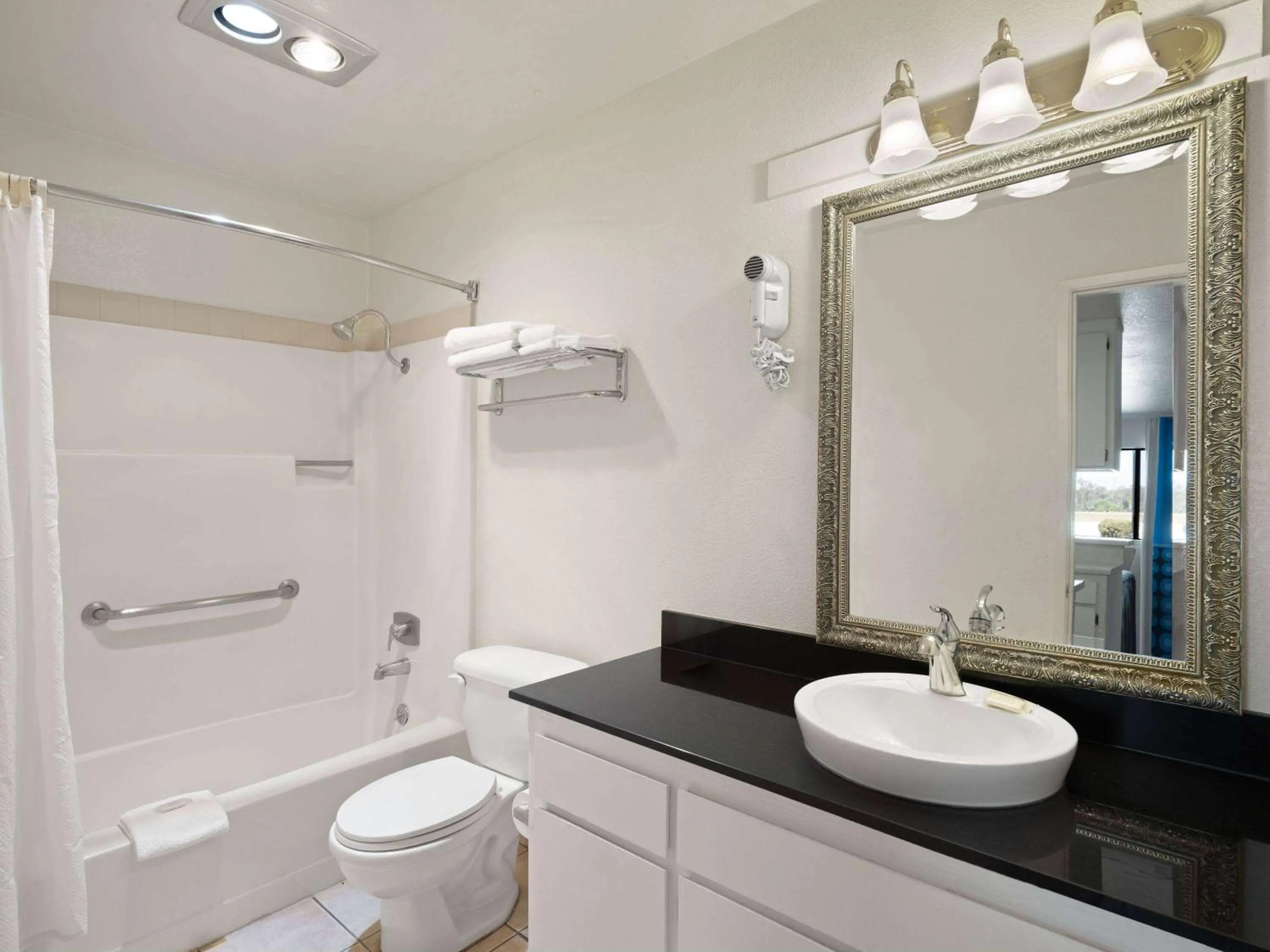 Bathroom in Super 8 by Wyndham Dunnigan