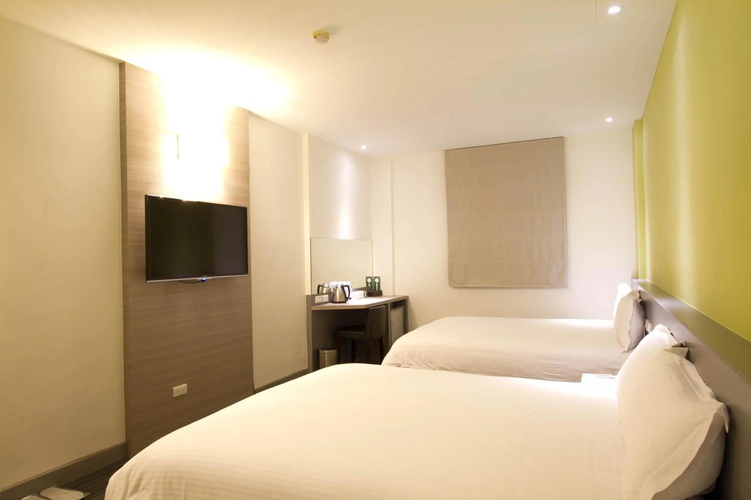 Bed in Hai Fu Hotel & Suites