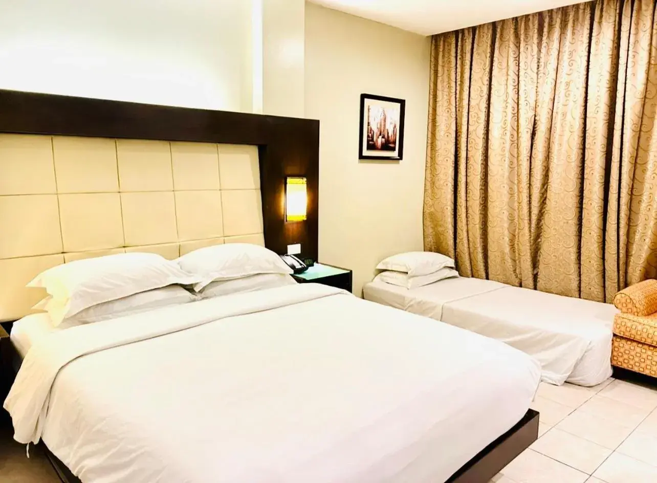 Deluxe Triple Room in Circle Inn Hotel and Suites Bacolod Deluxe Triple Room in Circle Inn Hotel and Suites Bacolod