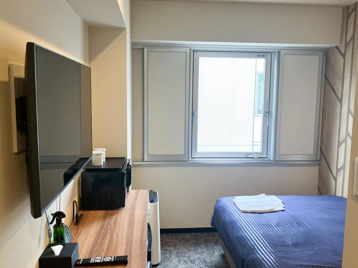 Bed in HOTEL LiVEMAX BUDGET Hiratsuka Ekimae