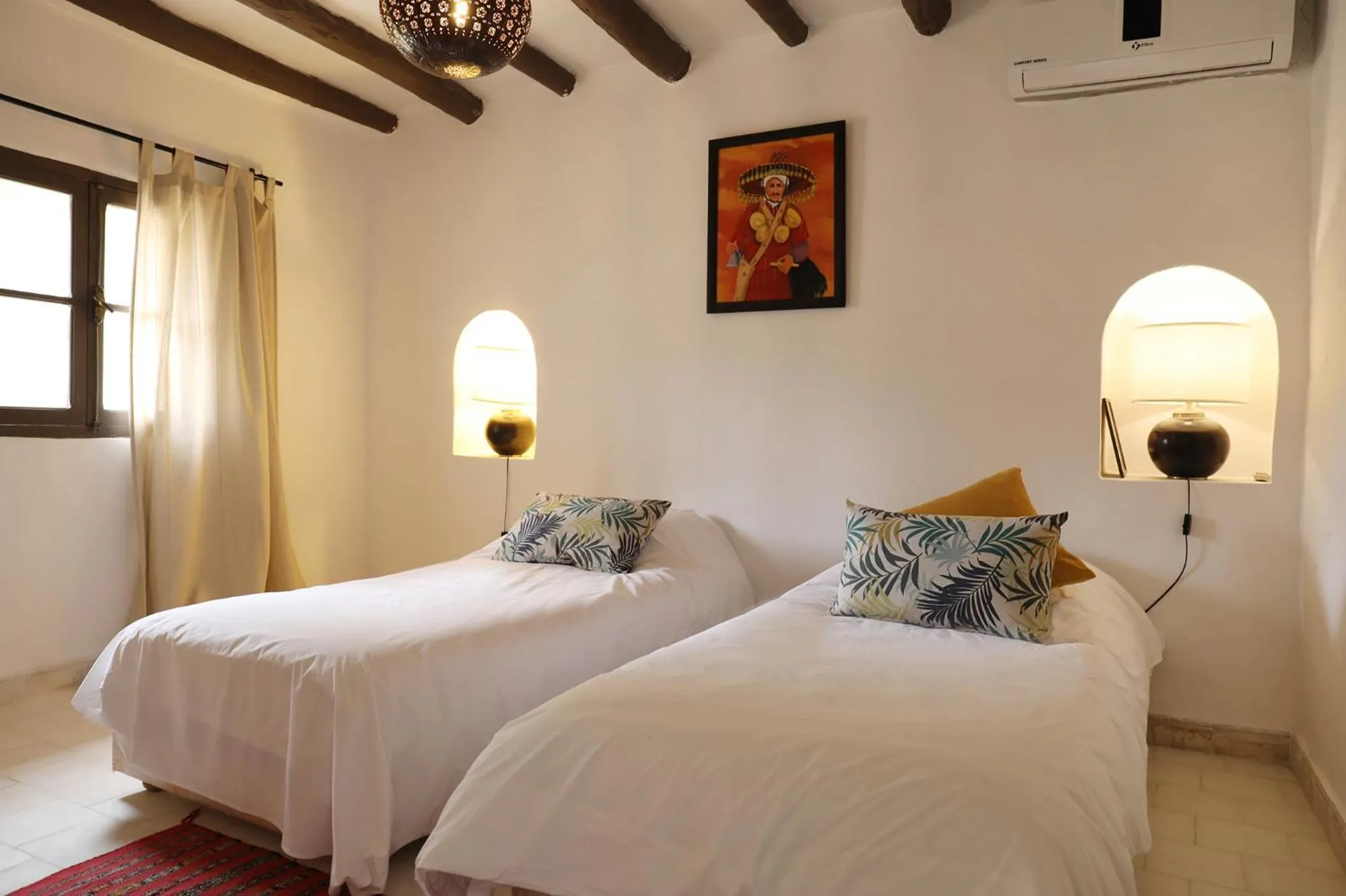 Bed in Le Petit Hôtel du Flouka