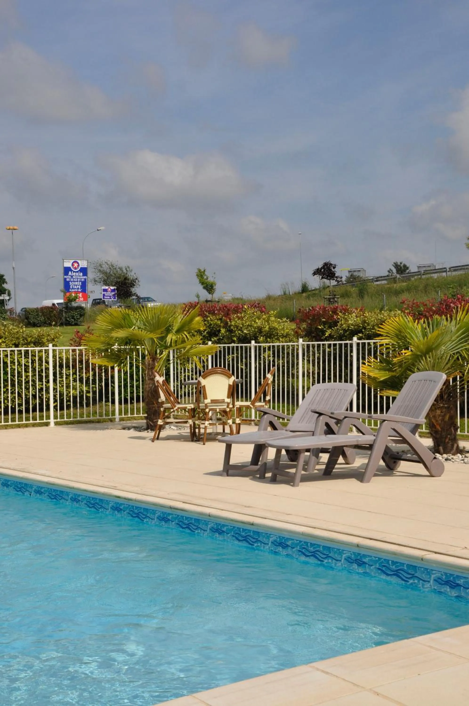 Swimming pool in BRIT HOTEL CONFORT ALEXIA - La Souterraine