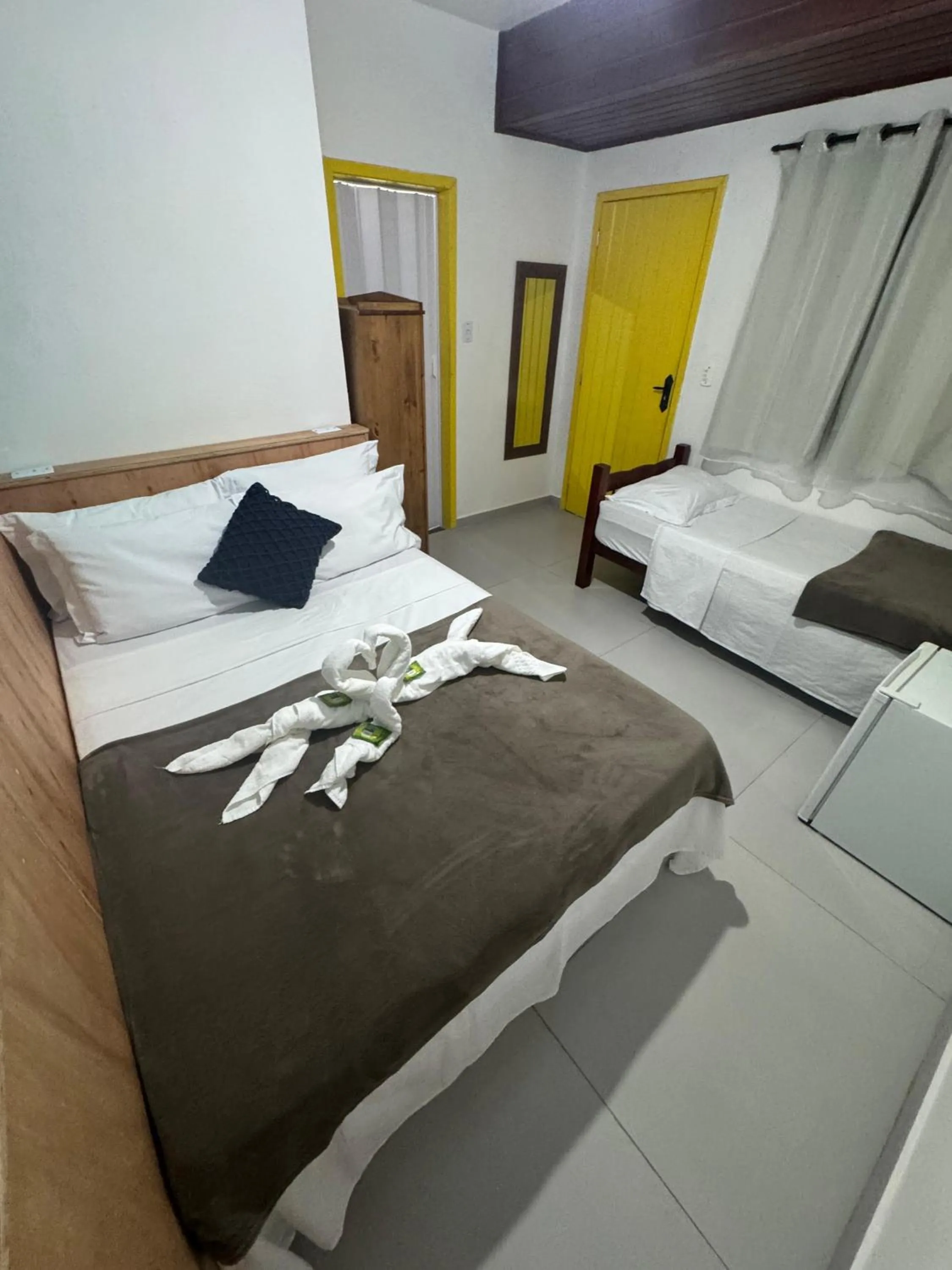 Bed in Pousada Tropical Araçatiba