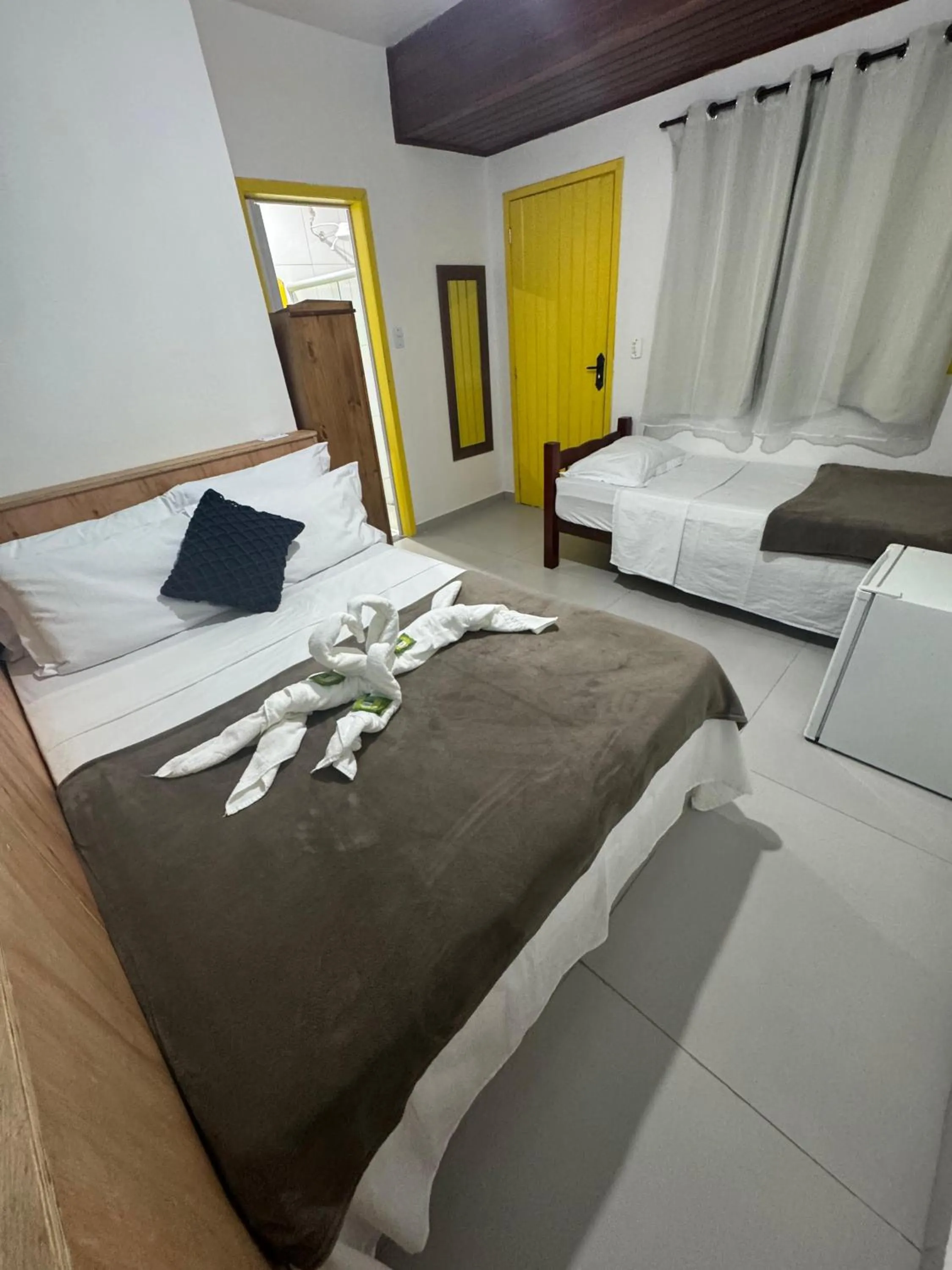 Bed in Pousada Tropical Araçatiba