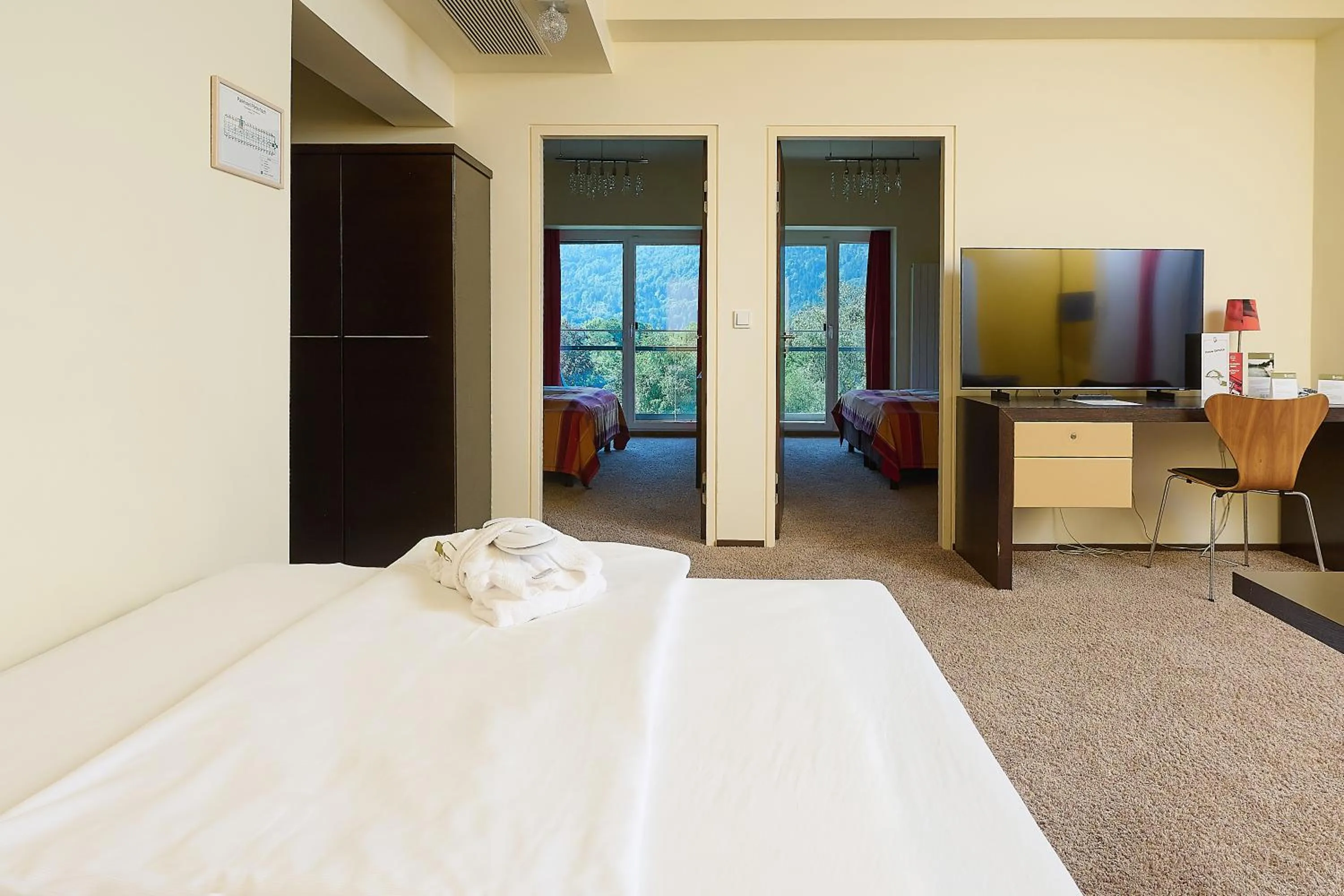 Photo of the whole room, Bed in Parkhotel Pörtschach - Das Hotelresort mit Insellage am Wörthersee