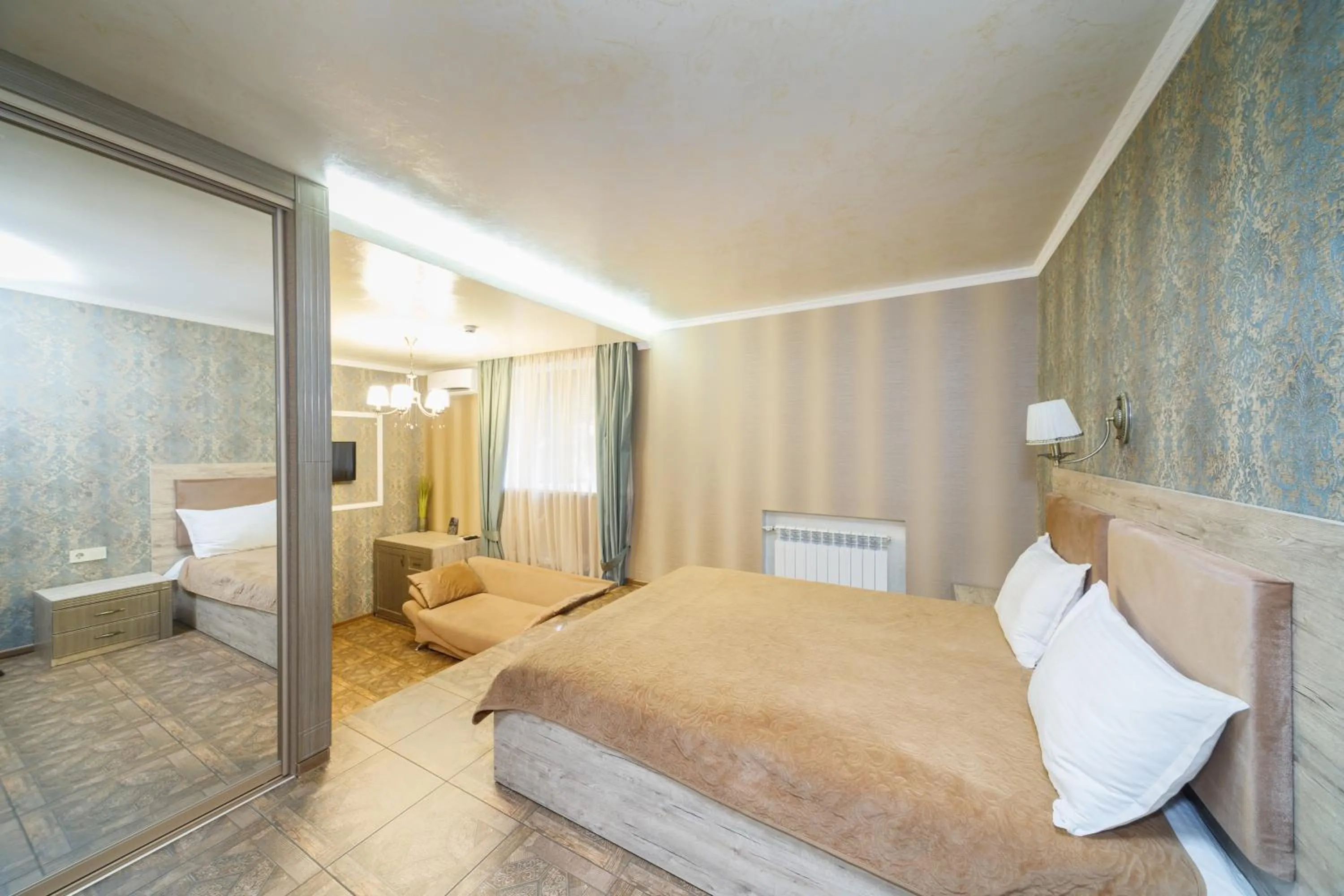 Bed in L.O.Y Family Hotel