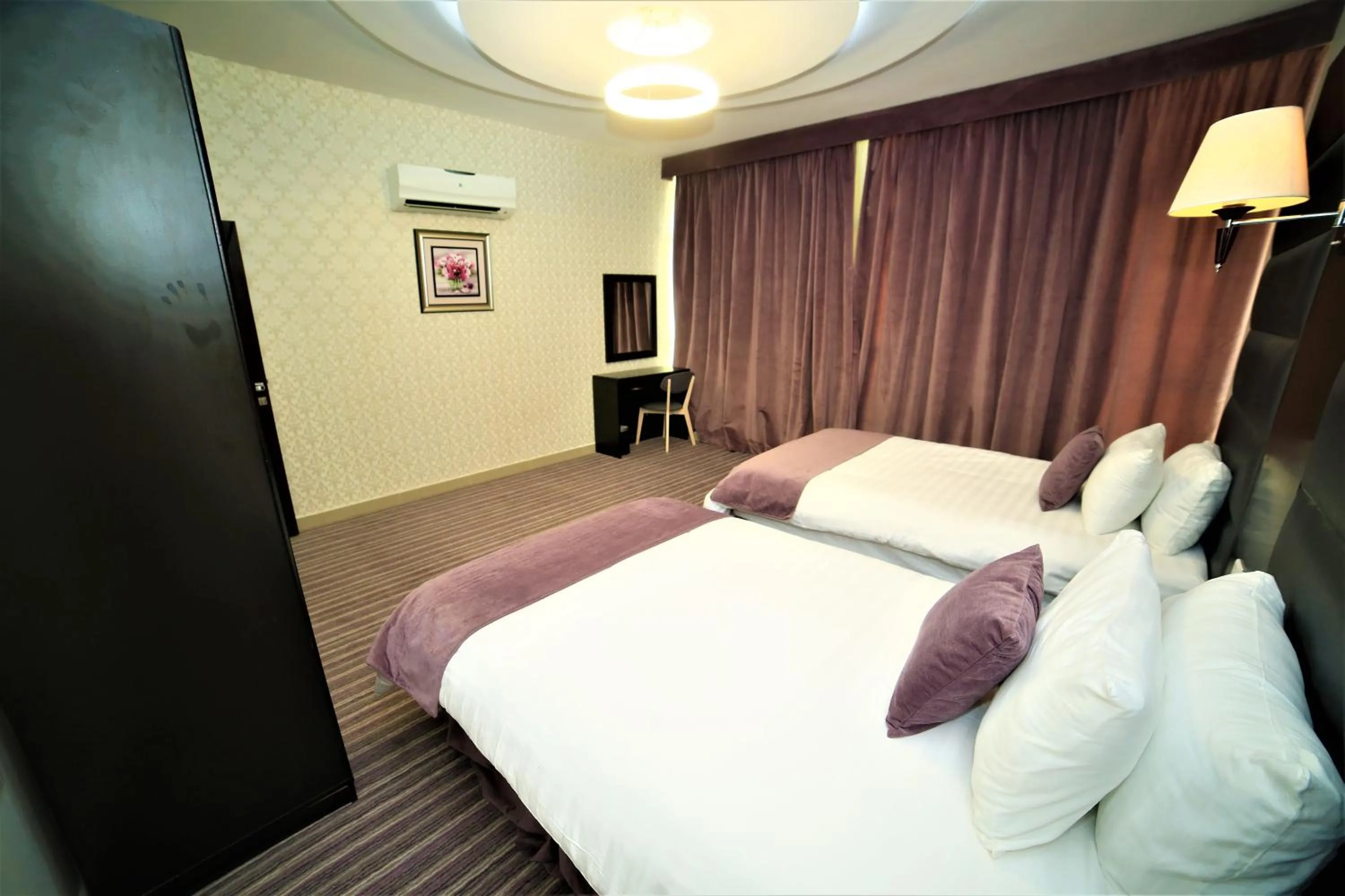 Bed in Al Dyafa Hotel Suites