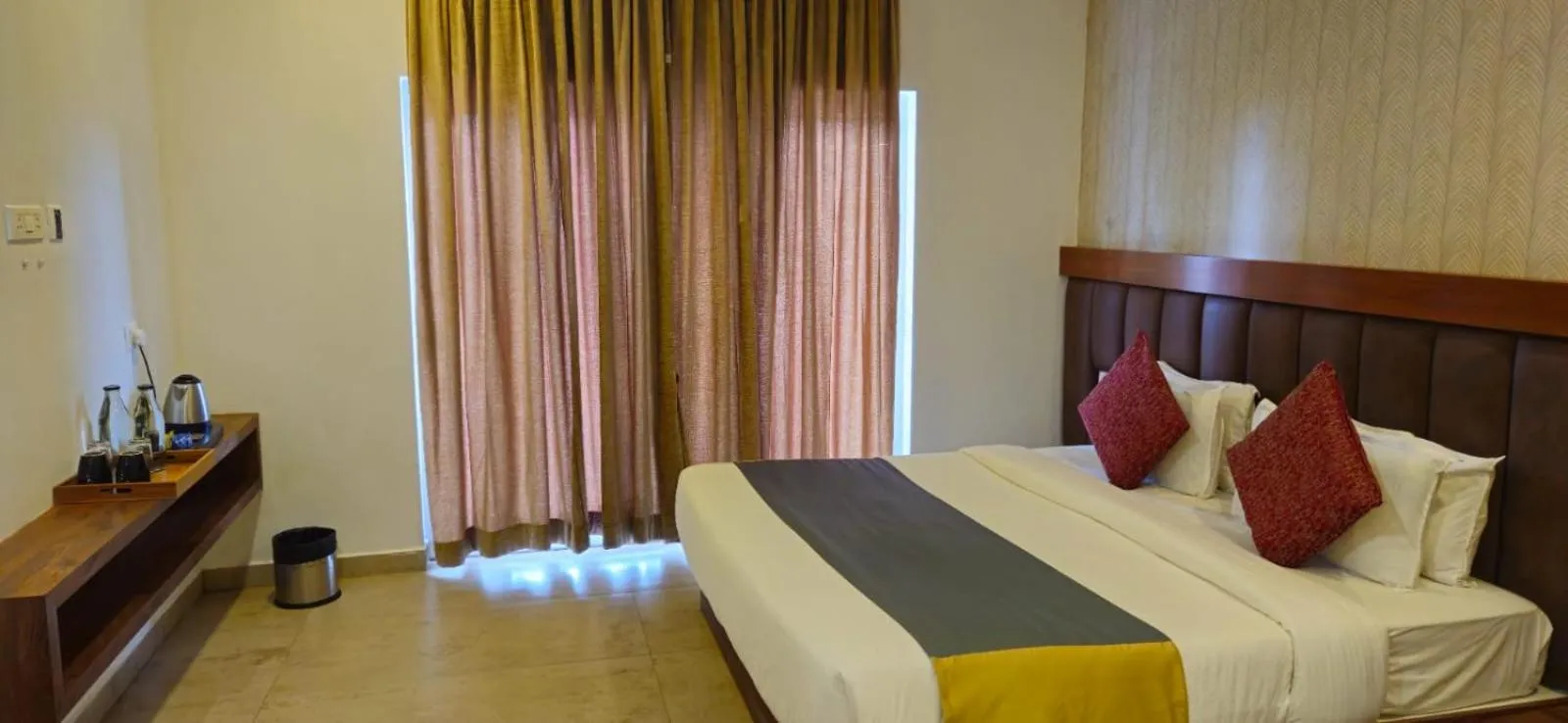 Bed in Elixir Hills Suites Resort and Spa
