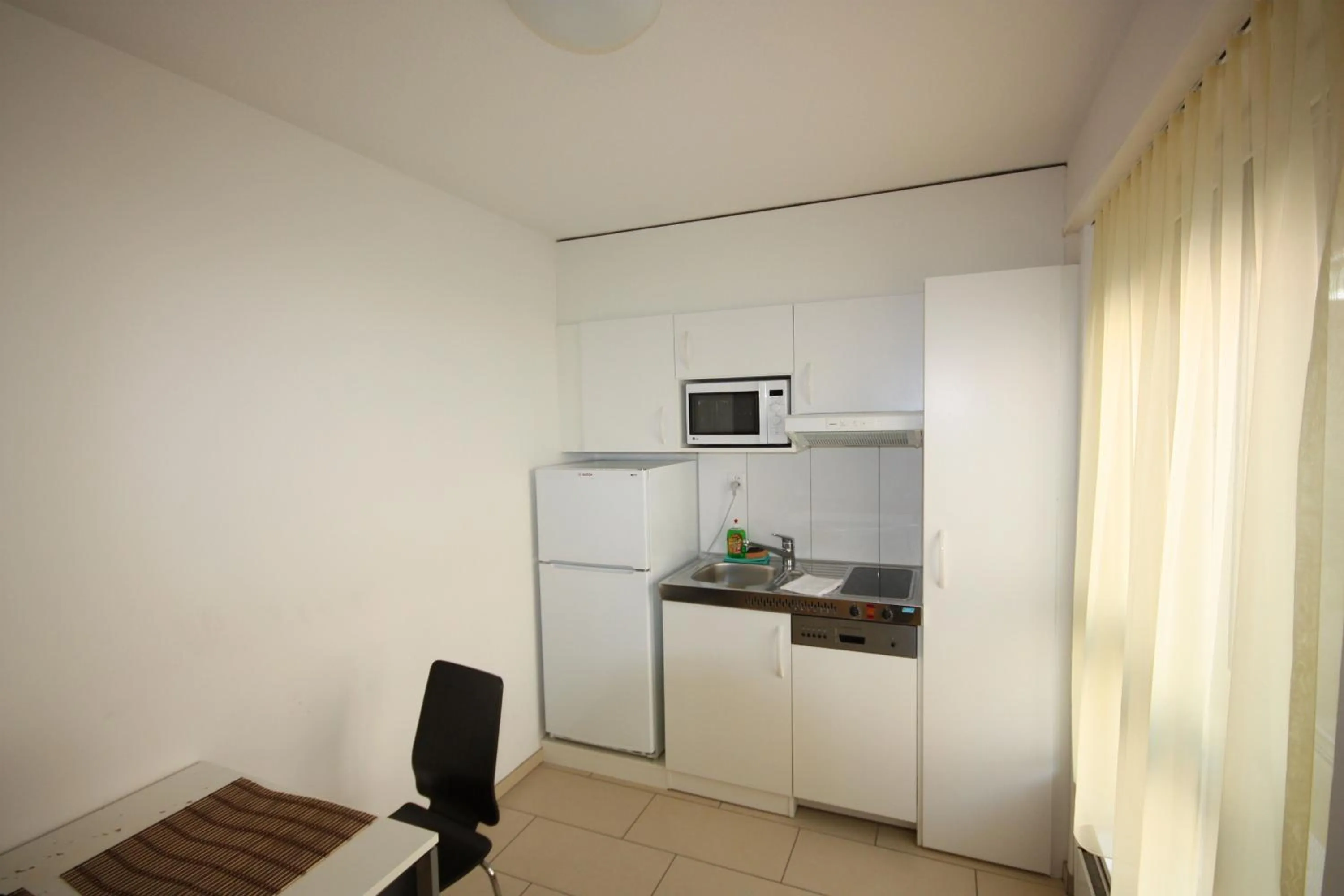 Kitchen or kitchenette in Swiss Star District 11 - Self Check-In