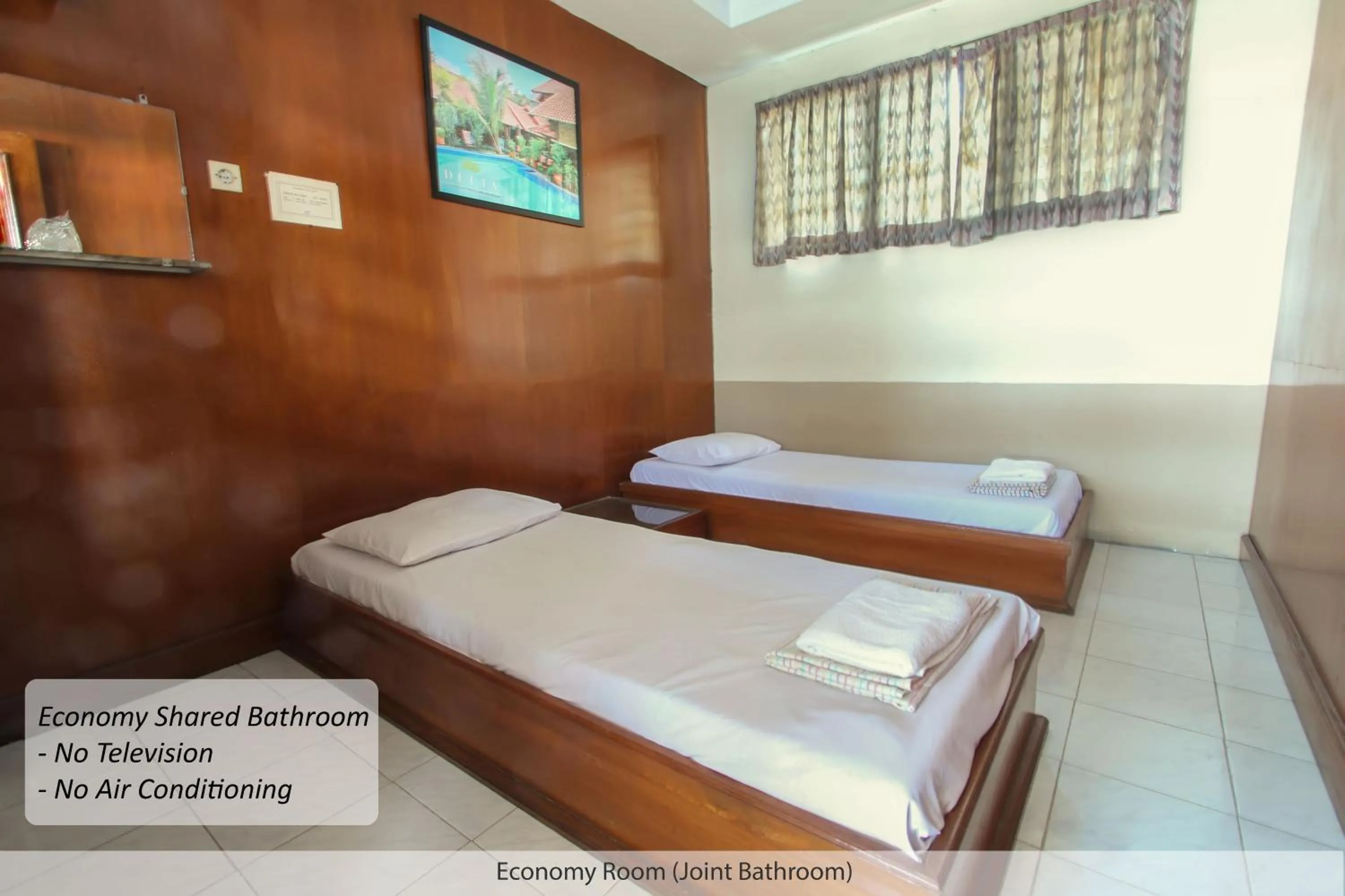 Seating area, Bed in Duta Guest House