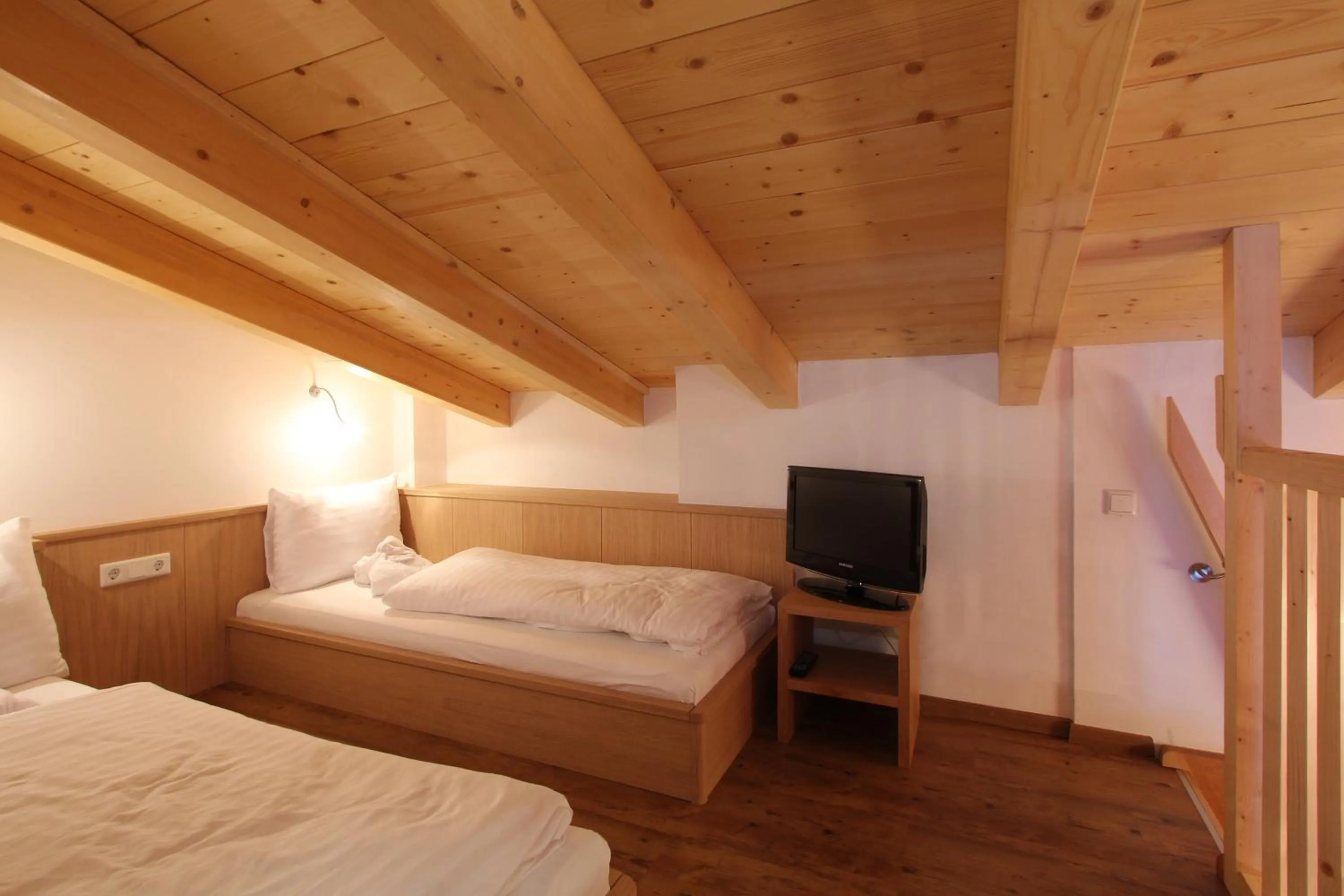 Bed in AvenidA Mountain Resort by Alpin Rentals
