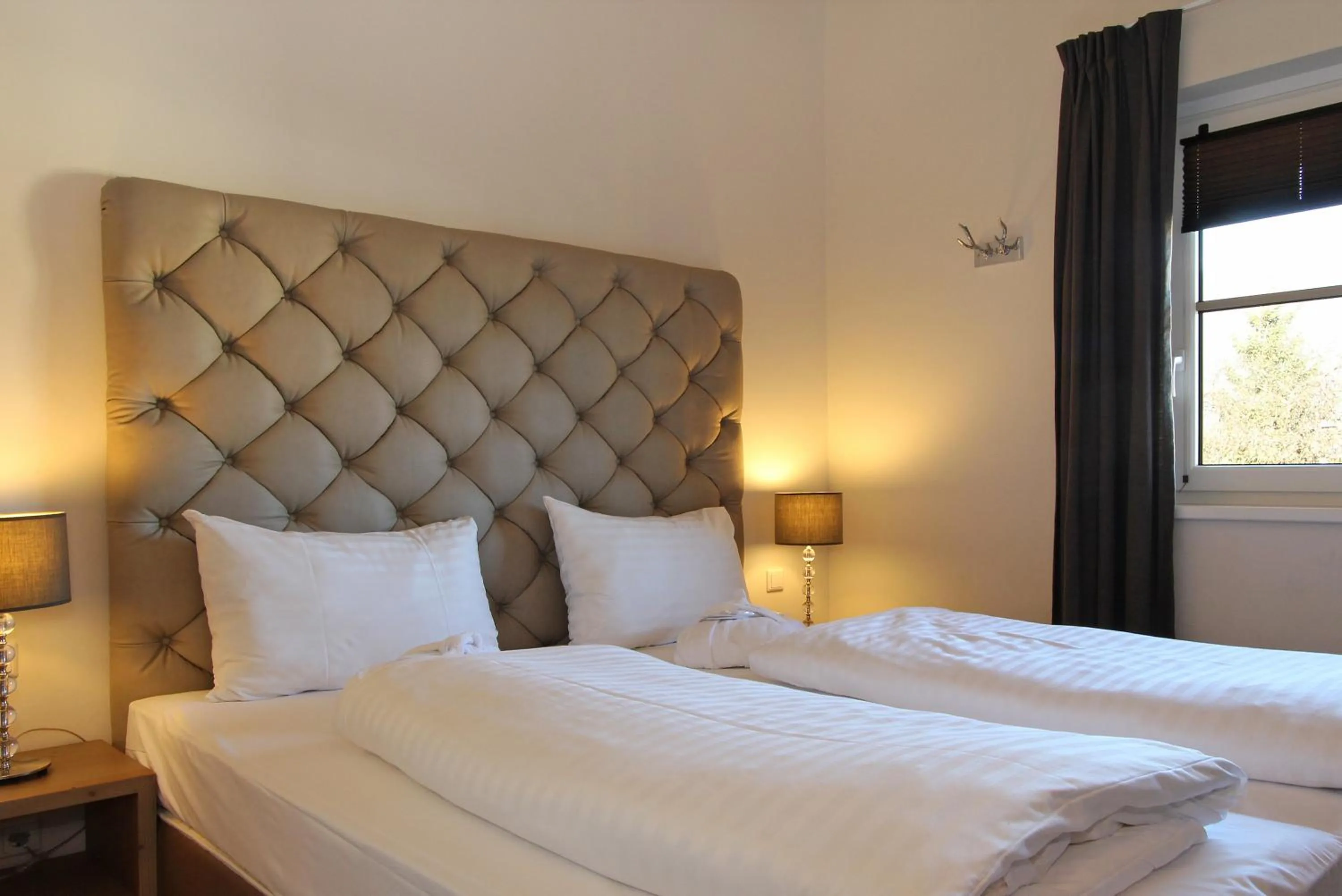 Bed in AvenidA Mountain Resort by Alpin Rentals