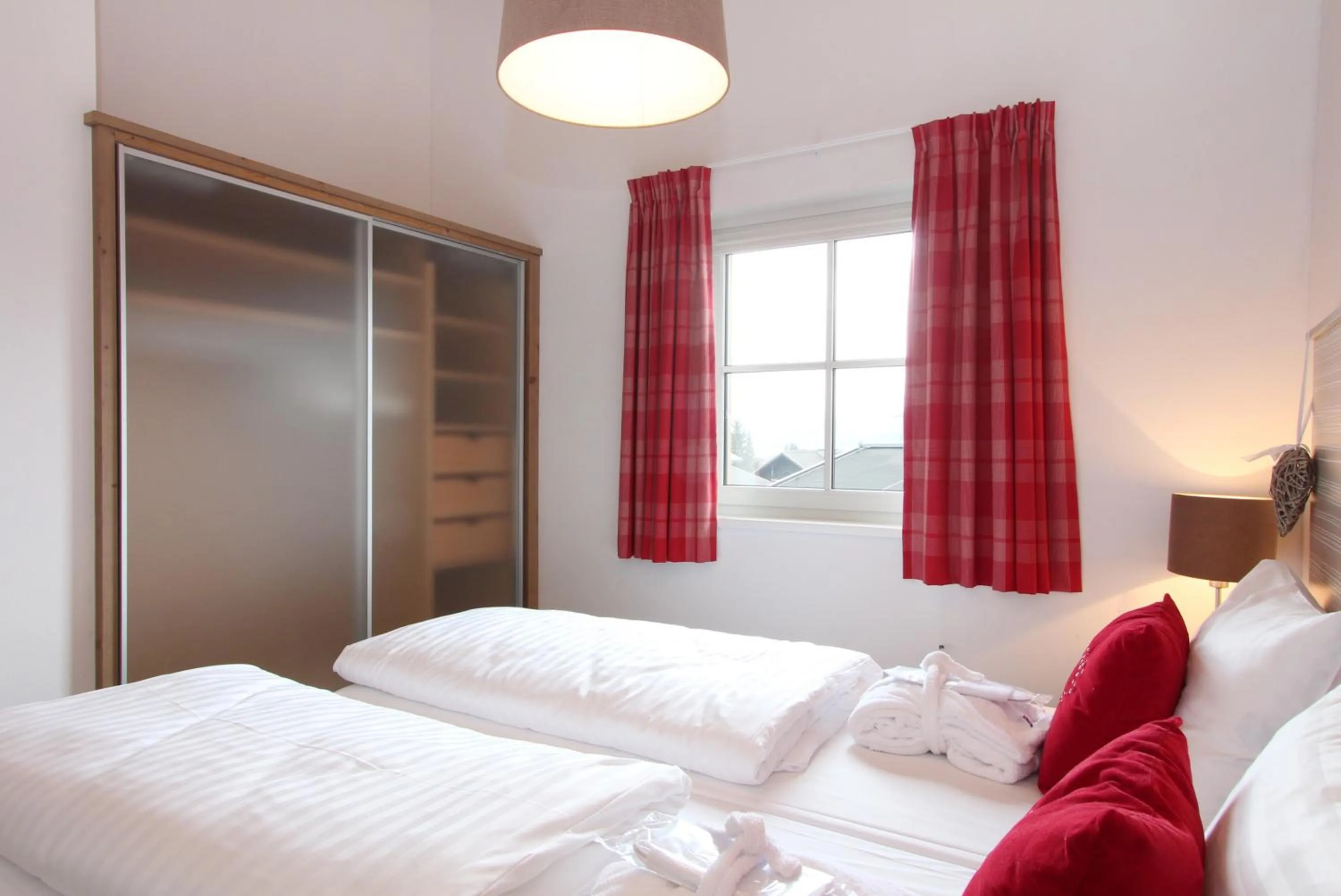 Bed in AvenidA Mountain Resort by Alpin Rentals