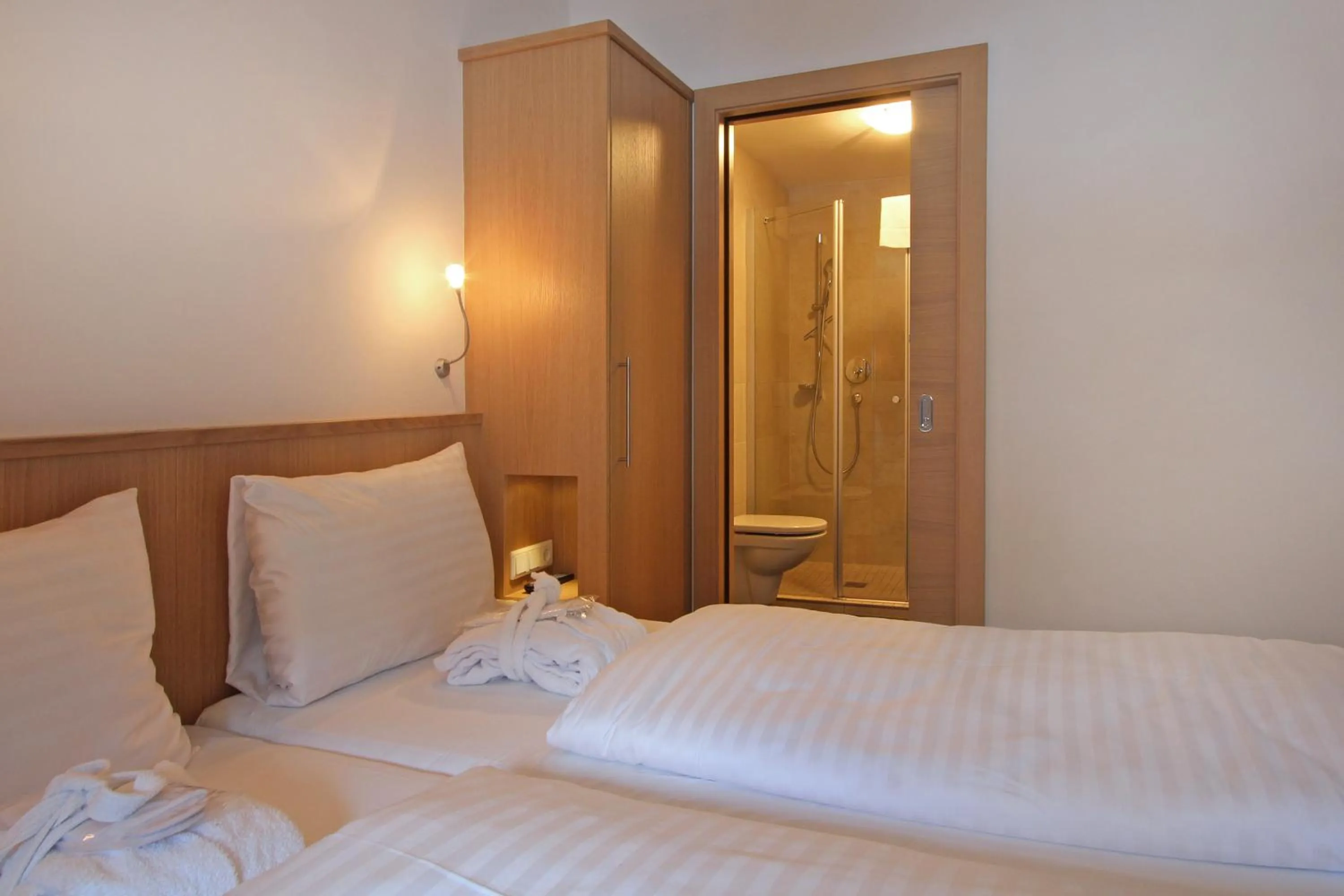 Bed in AvenidA Mountain Resort by Alpin Rentals