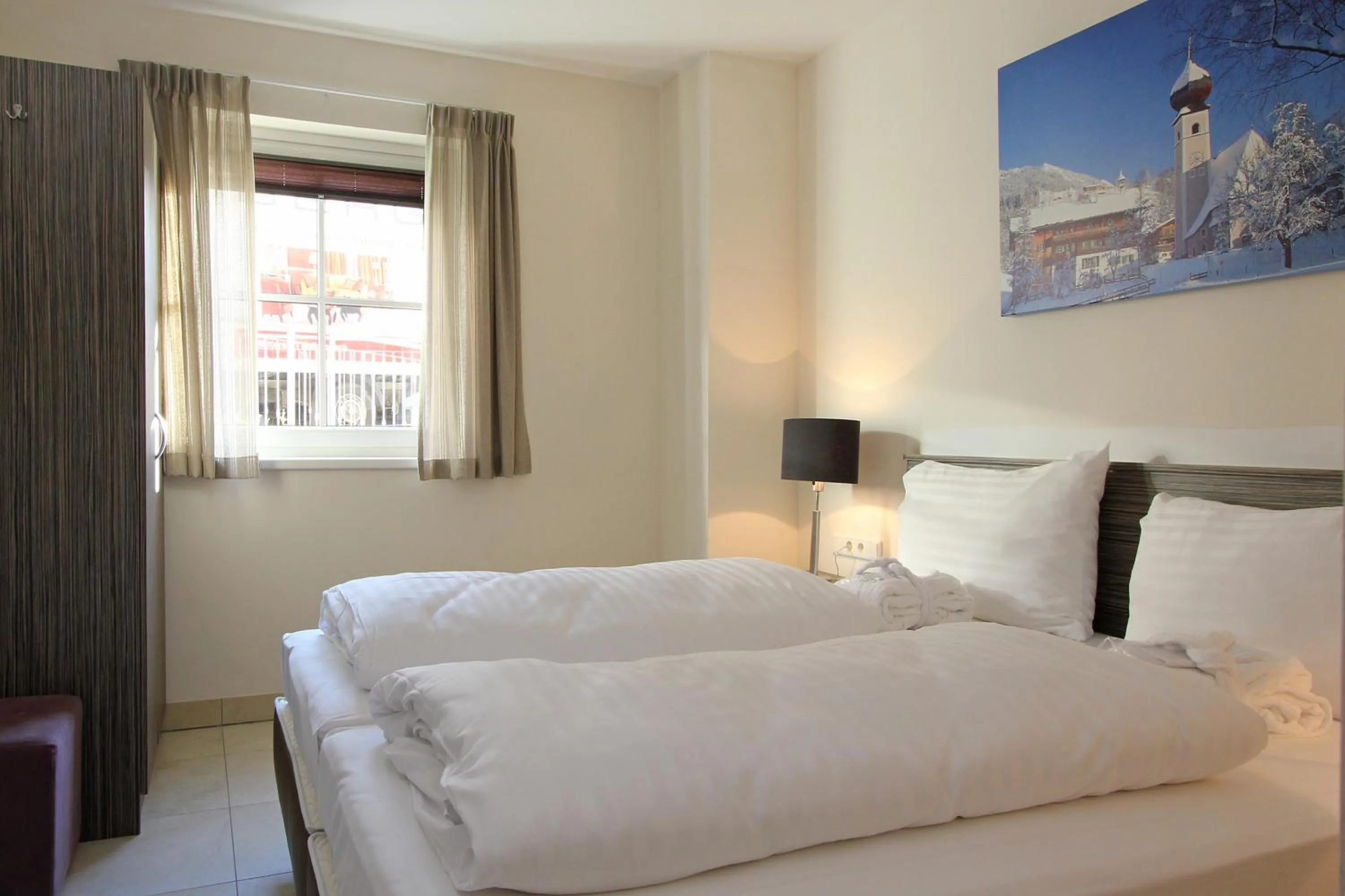 Bed in AvenidA Mountain Resort by Alpin Rentals