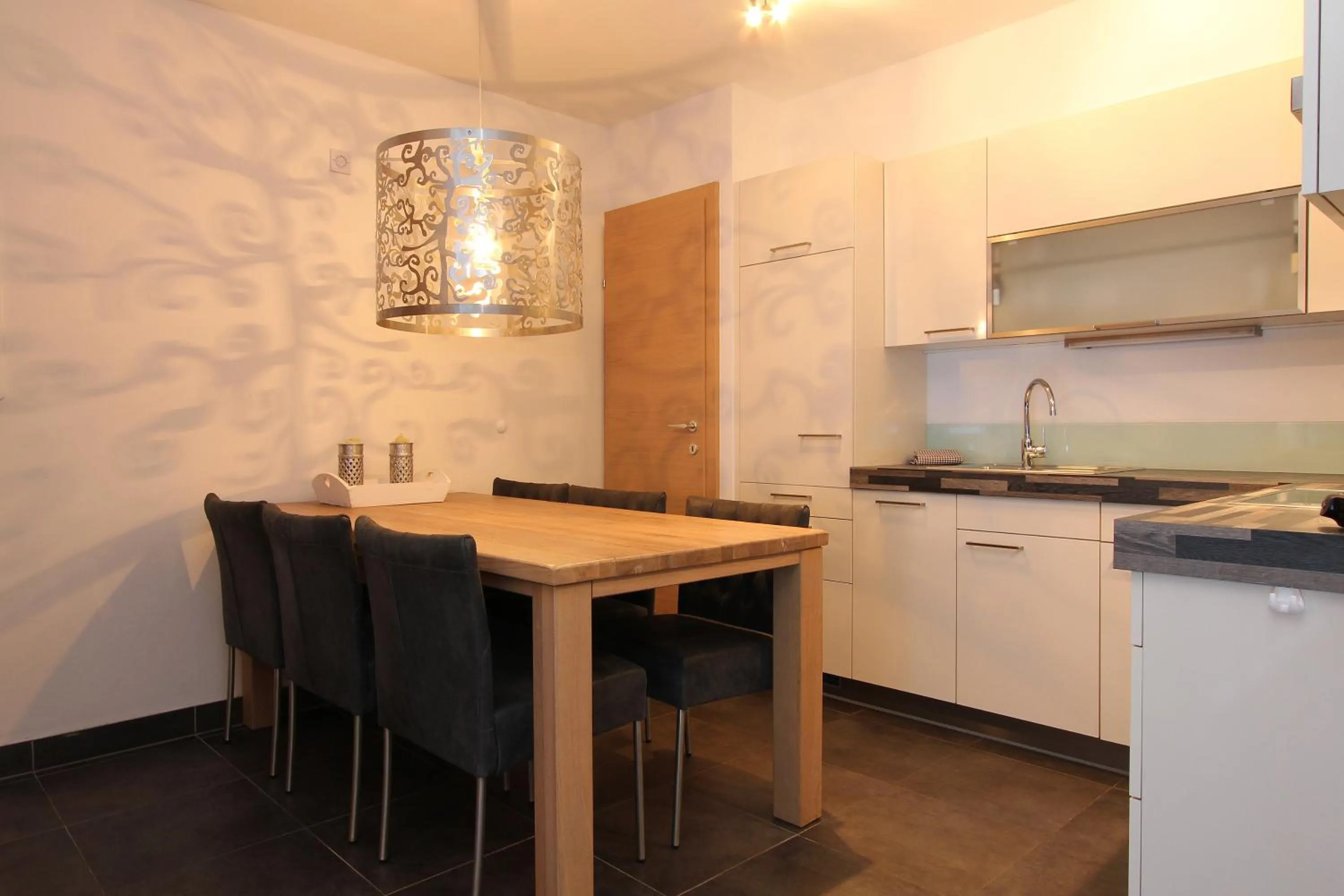 Kitchen or kitchenette in AvenidA Mountain Resort by Alpin Rentals