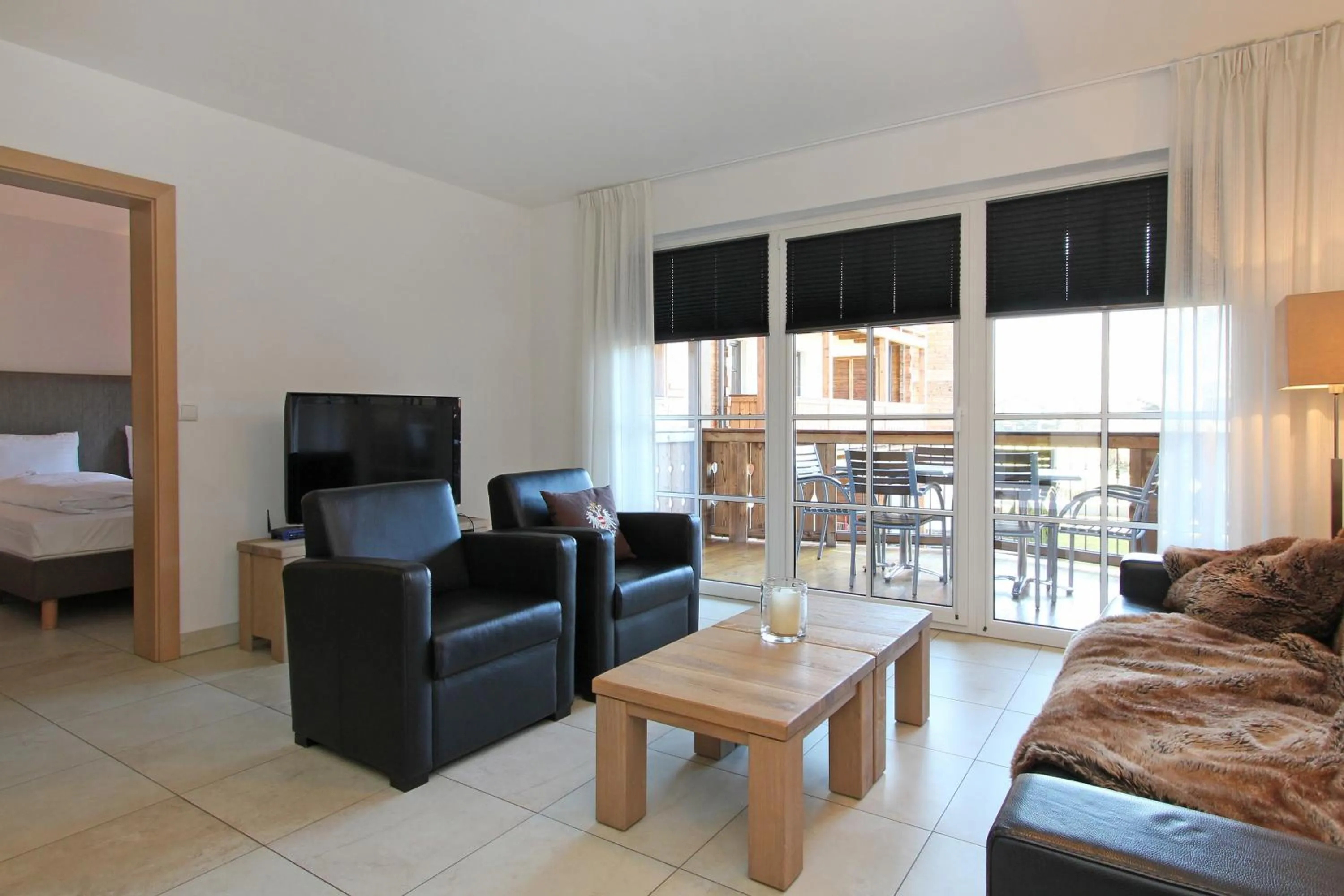 Living room, Bed in AvenidA Mountain Resort by Alpin Rentals