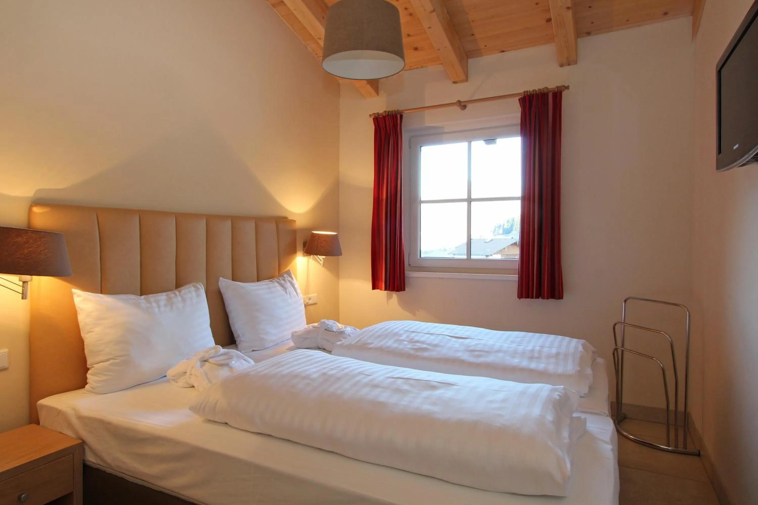 Bed in AvenidA Mountain Resort by Alpin Rentals