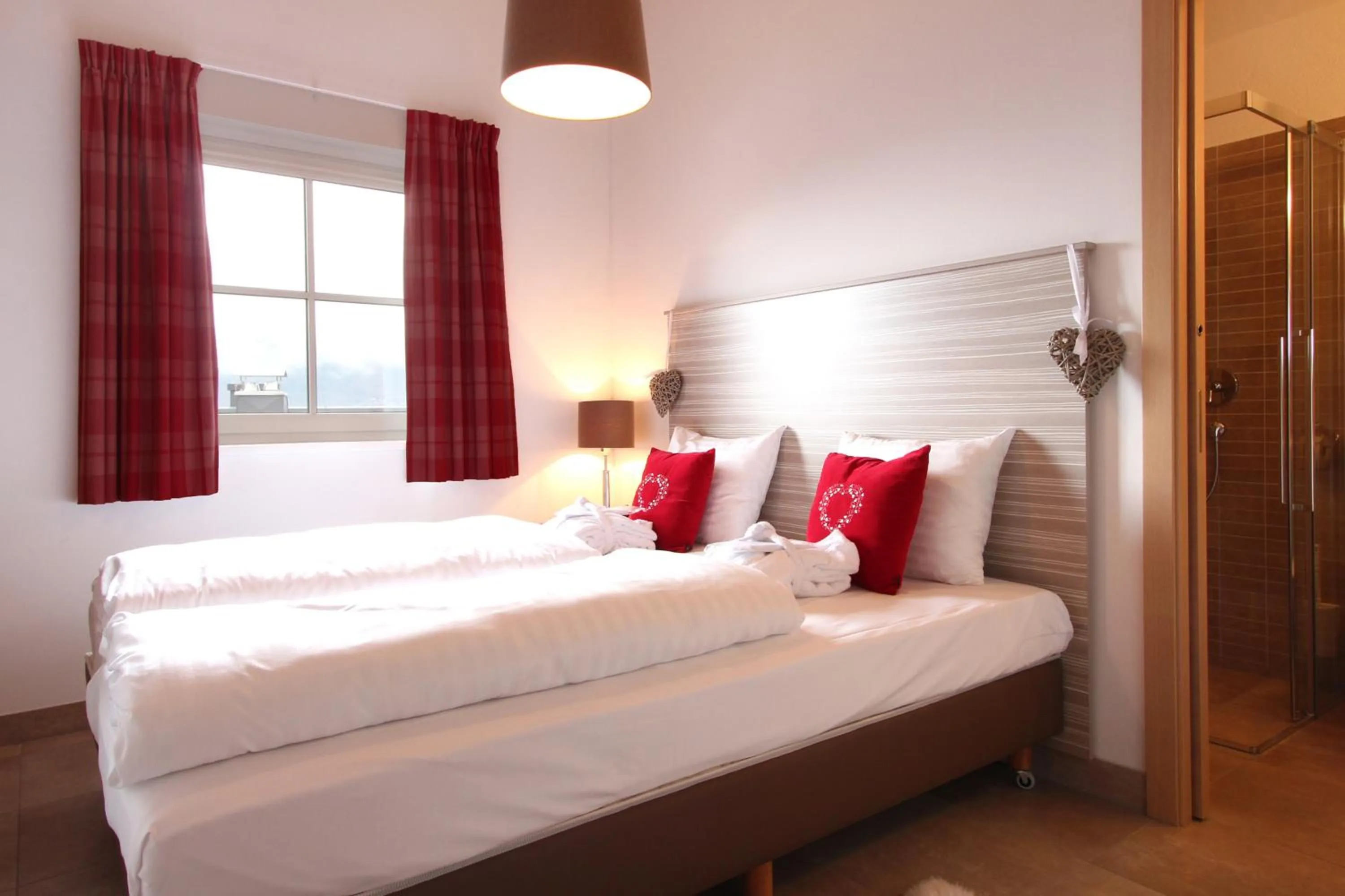 Bed in AvenidA Mountain Resort by Alpin Rentals